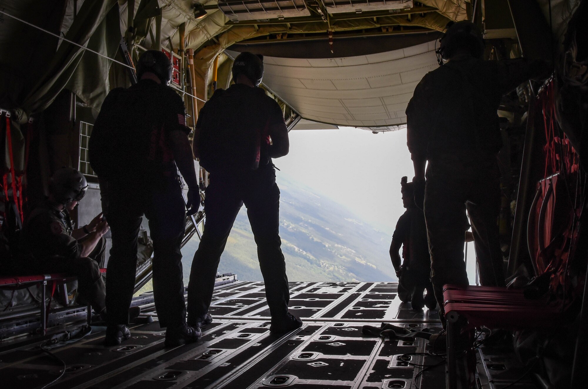 The U.S. Army Special Operations Command Parachute Demonstration Team prepares to jump out of a C-130J Super Hercules from the 815th Airlift Squadron at Keesler Air Force Base, Miss., May 3, 2019. The Black Daggers practiced their demonstration in preparation for the Thunder Over the Sound Air and Space Show.  (U.S. Air Force photo by Staff Sgt. Diana Cossaboom)