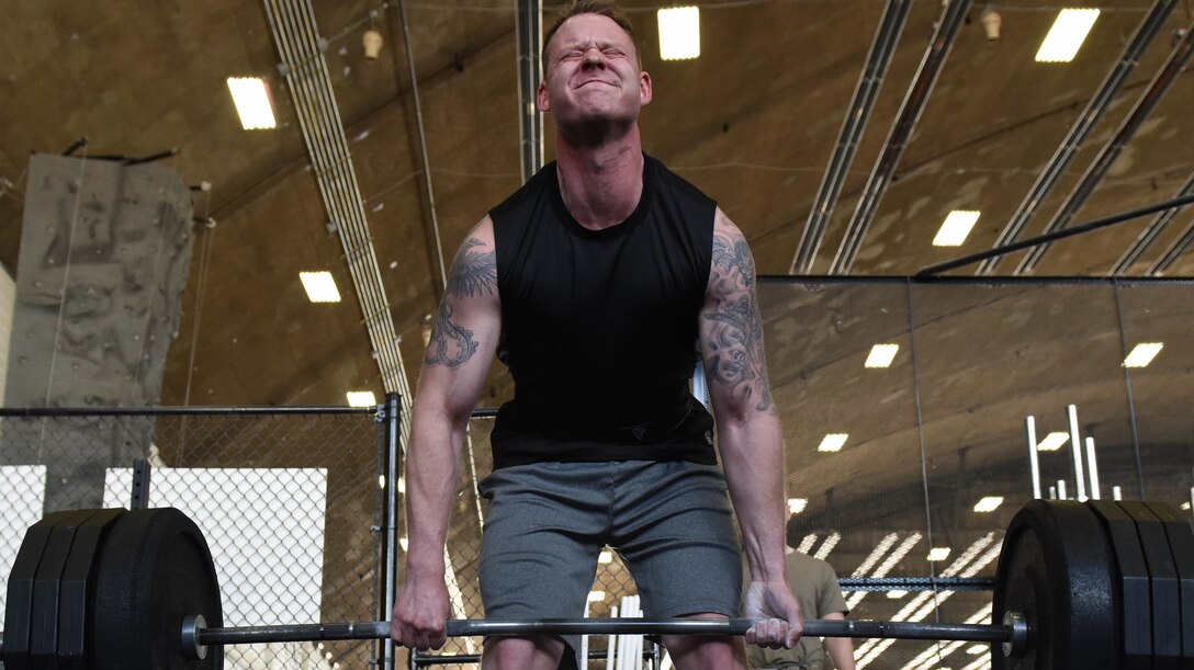 Staff Sgt. Jacob Restemayer, assigned to the 28th Logistics Readiness Squadron, deadlifts more than 400 pounds during the first component of the Ellsworth Air Force Base’s Strongest Competition at the Pride Hangar on Ellsworth AFB, S.D., April 25, 2019. Event participants faced off for the title of strongest man or woman on base, competing in the five different areas: max-out deadlift, farmer’s carry, tire flip, keg run and vehicle pull. (U.S. Air Force photo by Tech. Sgt. Jette Carr)