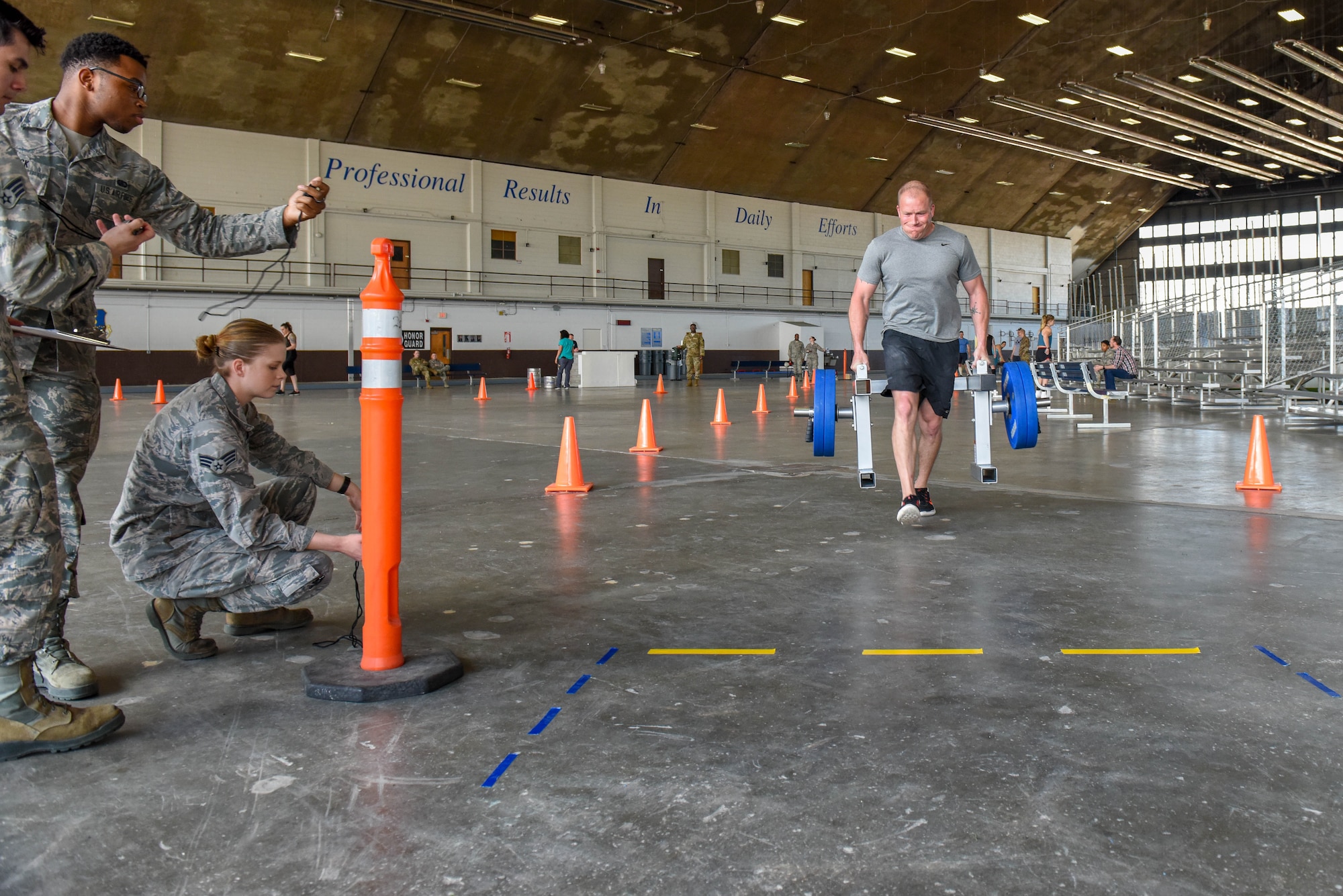 Tech. Sgt. Dustin Jespersen, a 28th Operations Squadron survival, evasion, resistance and escape specialist, performs a farmer’s carry during the Ellsworth Air Force Base’s Strongest Competition at the Pride Hangar on Ellsworth AFB, S.D., April 25, 2019. The free event was hosted by the 28th Force Support Squadron. Competitors performed feats of strength throughout five different exercises: max-out deadlift, farmer’s carry, keg run, tire flip and vehicle pull. Jespersen placed first as the strongest male. (U.S. Air Force photo by Tech. Sgt. Jette Carr)