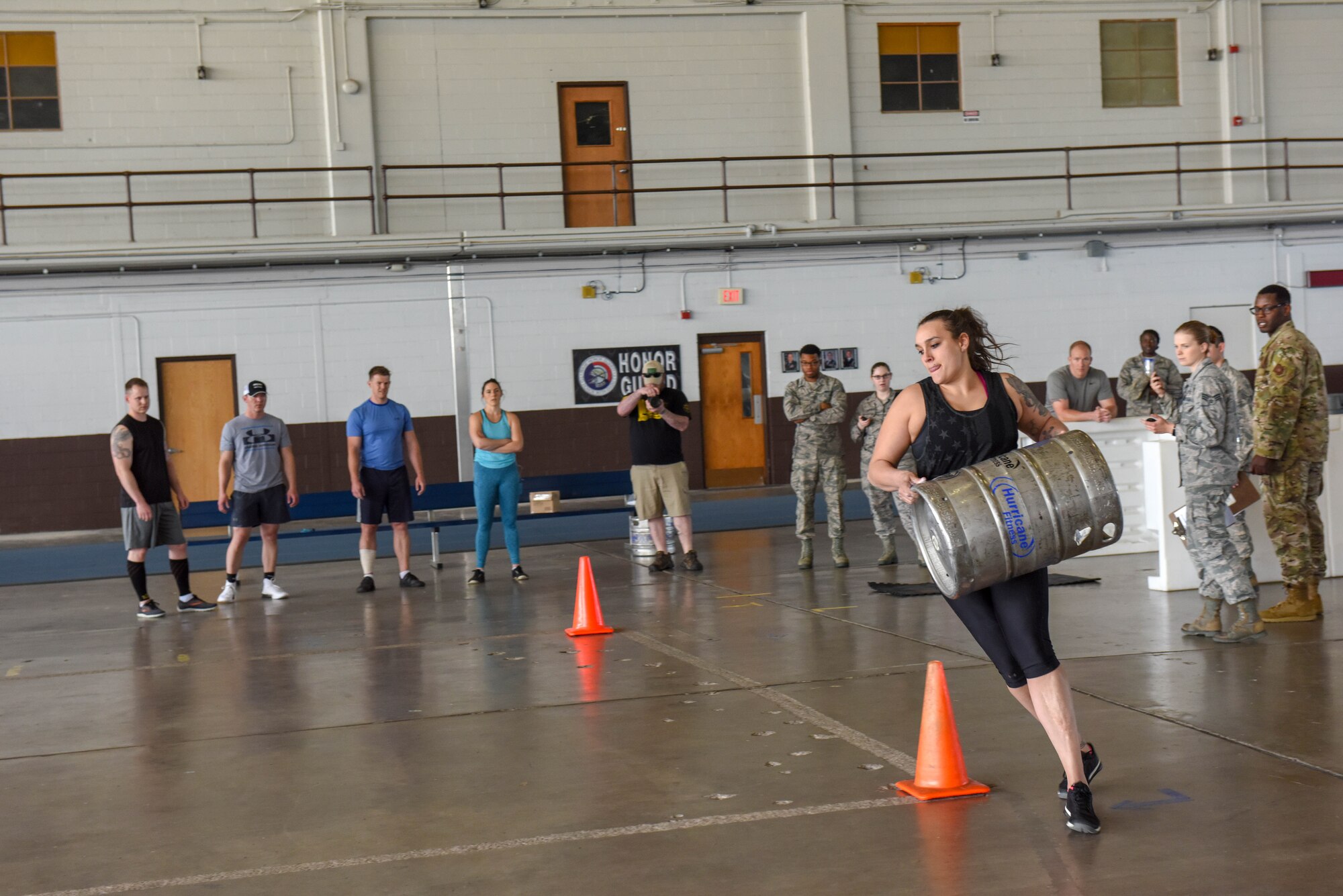 Staff Sgt. Brittany Binder, the 28th Force Support Squadron Fitness Assessment Cell noncommissioned officer in charge, runs while carrying a full-barrel keg during the Ellsworth Air Force Base’s Strongest Competition at the Pride Hangar on Ellsworth AFB, S.D., April 25, 2019. Half full of sand, the keg weighed between 60-70 pounds. Binder, who placed second in the female division, decided to compete because she wanted a new challenge that would bring her out of her comfort zone. (U.S. Air Force photo by Tech. Sgt. Jette Carr)