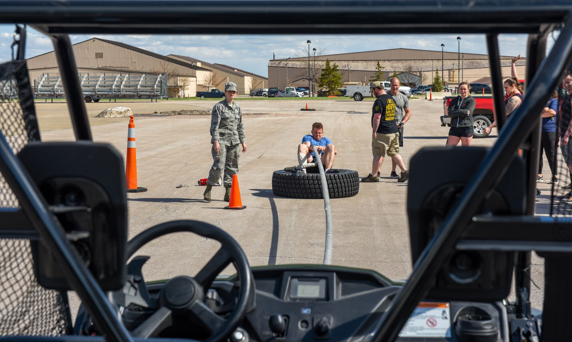 Capt. Max, assigned to the 89th Attack Squadron, is timed as he pulls an unmanned vehicle toward him for the Ellsworth Air Force Base’s Strongest Competition on Ellsworth AFB, S.D., April 25, 2019. After all the competitors took their turns towing the vehicle across the line, they stepped up their game and also took turns pulling in a bus. During the free event, which was hosted by the 28th Force Support Squadron, participants performed feats of strength via five exercises: max-out deadlift, farmer’s carry, keg run, tire flip and vehicle pull.  (U.S. Air Force photo by Tech. Sgt. Jette Carr)