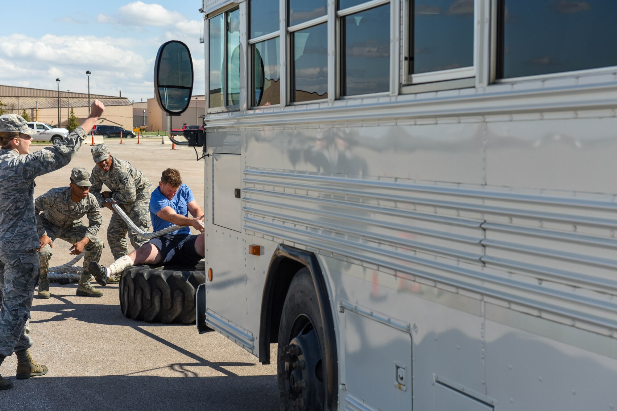 Capt. Max, assigned to the 89th Attack Squadron, pulls a bus toward him during the Ellsworth Air Force Base’s Strongest Competition on Ellsworth AFB, S.D., April 25, 2019. During the free event, which was hosted by the 28th Force Support Squadron, participants performed feats of strength via five exercises: max-out deadlift, farmer’s carry, keg run, tire flip and vehicle pull.  (U.S. Air Force photo by Tech. Sgt. Jette Carr)