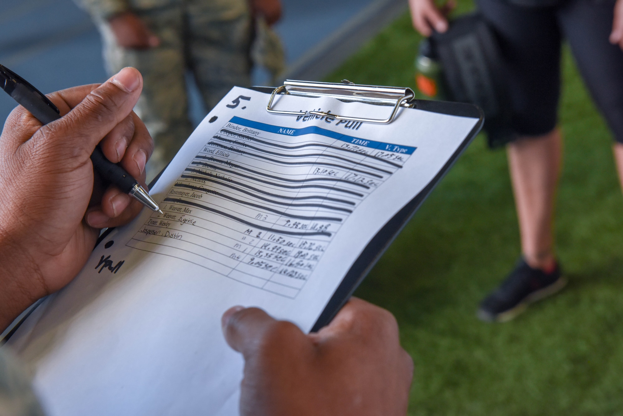 Senior Airman Von Black, a 28th Force Support Squadron fitness apprentice tallies up competitors’ scores to determine the winners of the Ellsworth Air Force Base’s Strongest Competition at the Pride Hangar on Ellsworth AFB, S.D., April 25, 2019. Event participants faced off on five tests of strength: max-out deadlift, farmer’s carry, tire flip, keg run and vehicle pull. (U.S. Air Force photo by Tech. Sgt. Jette Carr)