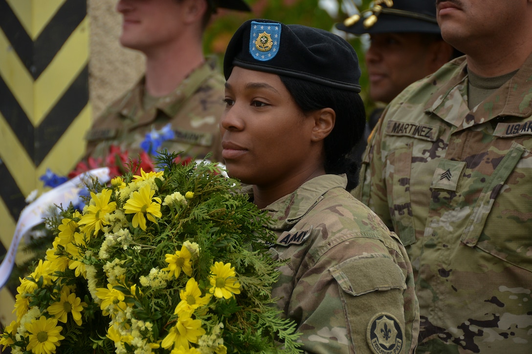 A soldier prepares to present a wreath.