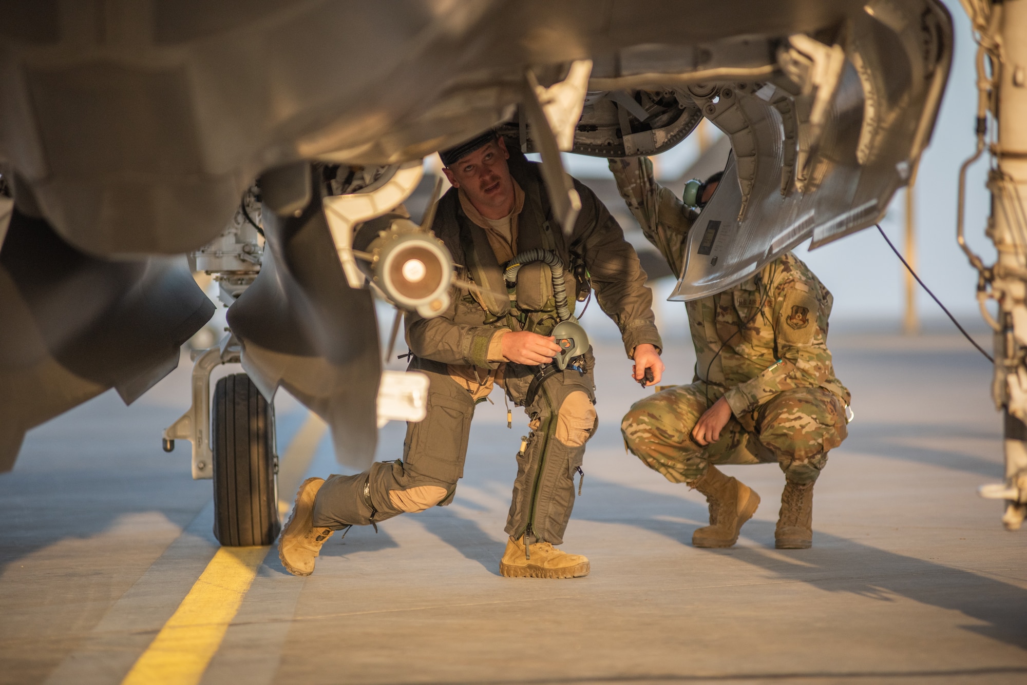 A pilot from 4th Expeditionary Fighter Squadron performs a preflight check on an F-35A Lightning II April 26, 2019, at Al Dhafra Air Base, United Arab Emirates.