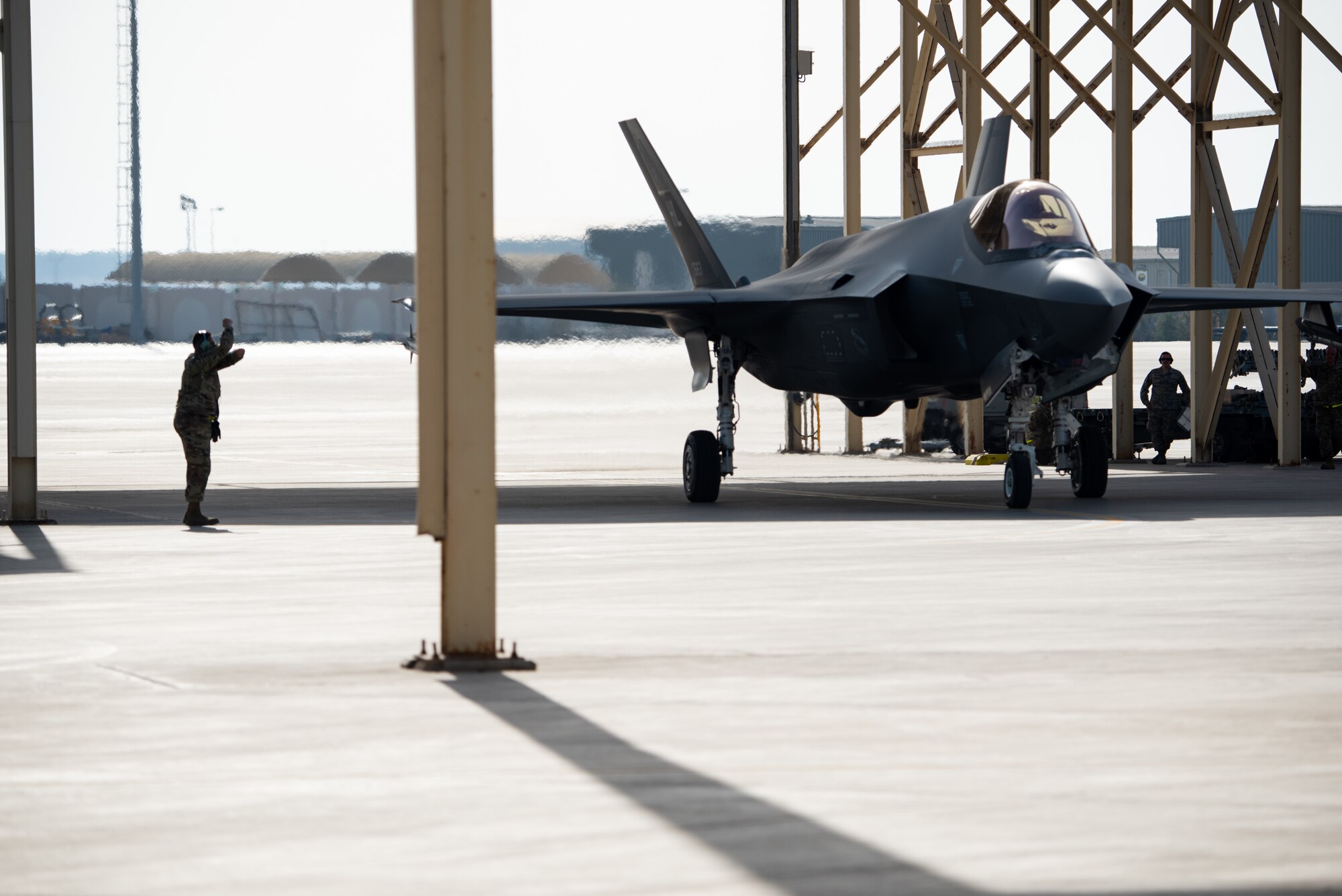 Staff Sgt. Benito Aranda, 380th Expeditionary Aircraft Maintenance Squadron crew chief, marshals a 4th Expeditionary Fighter Squadron F-35A Lightning II pilot before takeoff April 26, 2019, at Al Dhafra Air Base, United Arab Emirates.