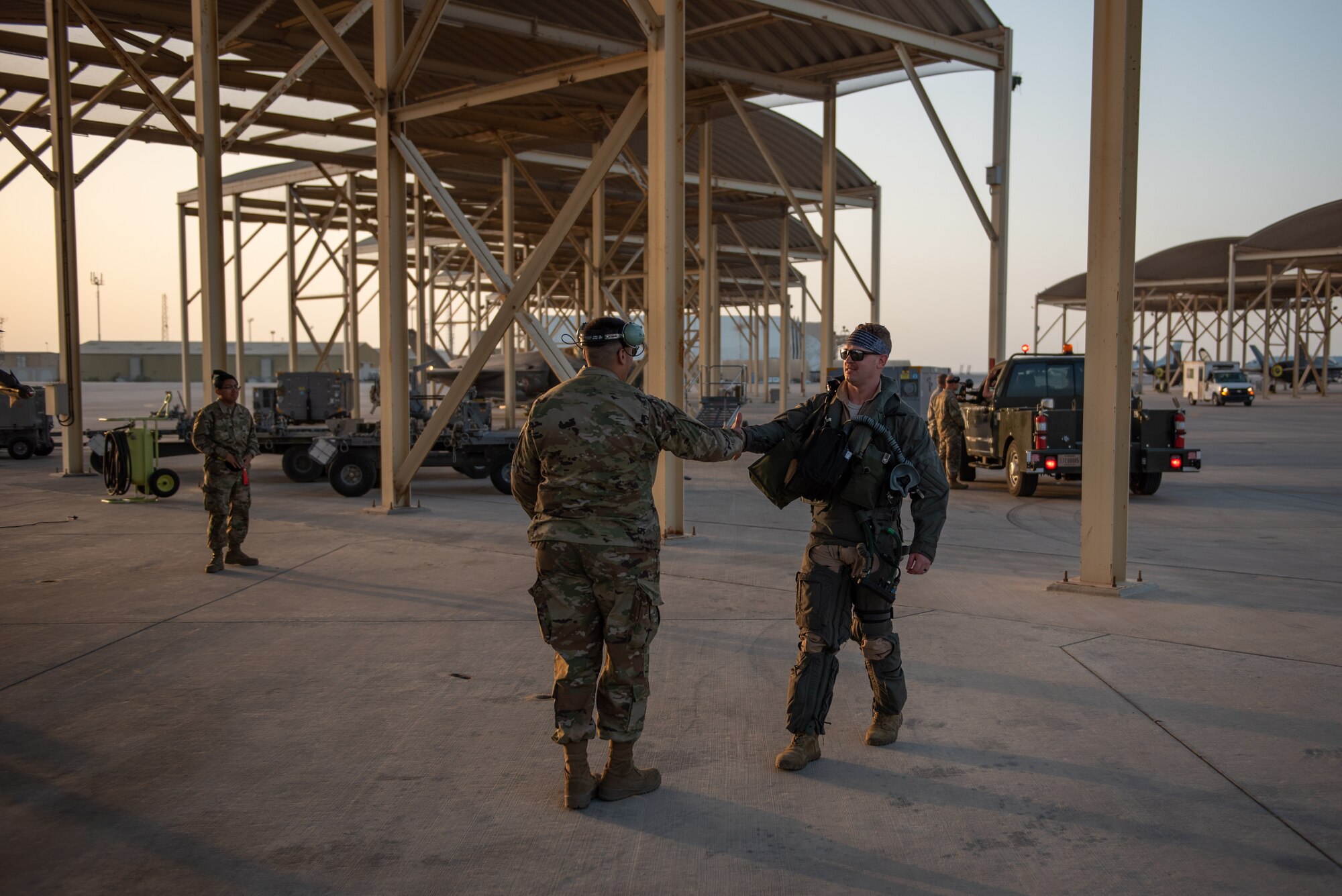 A 4th Expeditionary Fighter Squadron F-35A Lightning II pilot meets a crew chief April 26, 2019, at Al Dhafra Air Base, United Arab Emirates.