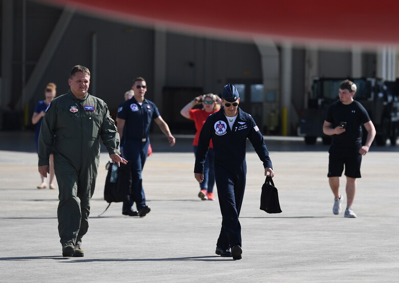 Dr. Todd Boucher, Popps Ferry Elementary School principal, walks for a flight with the U.S. Air Force Thunderbirds in an F-16 Fighting Falcon, May 2, 2019, in Gulfport, Mississippi. The Thunderbirds are headlining the Keesler and Biloxi Air and Space Show May 4-5. Thunder Over the Sound is a unique, one-of-a-kind event where a base and its surrounding city have jointly hosted one air show taking place in two locations. (U.S. Air Force photo by Kemberly Groue)