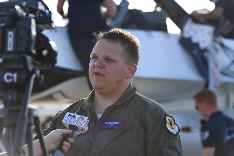 Dr. Todd Boucher, Popps Ferry Elementary School principal, speaks to local media after his flight with the U.S. Air Force Thunderbirds in an F-16 Fighting Falcon, May 2, 2019, in Gulfport, Mississippi. The Thunderbirds are headlining the Keesler and Biloxi Air and Space Show May 4-5. Thunder Over the Sound is a unique, one-of-a-kind event where a base and its surrounding city have jointly hosted one air show taking place in two locations. (U.S. Air Force photo by Kemberly Groue)