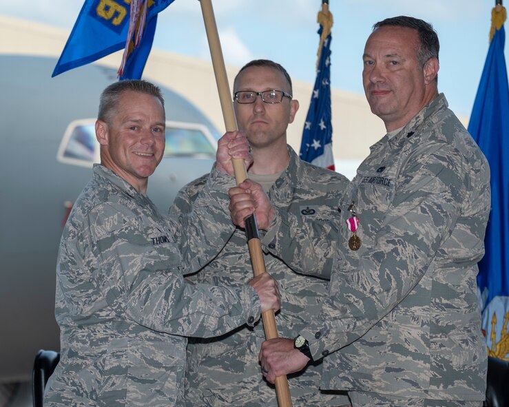 Col. Robert Thompson, 931st Maintenance Group commander, receives the 931st Aircraft Maintenance Squadron guidon