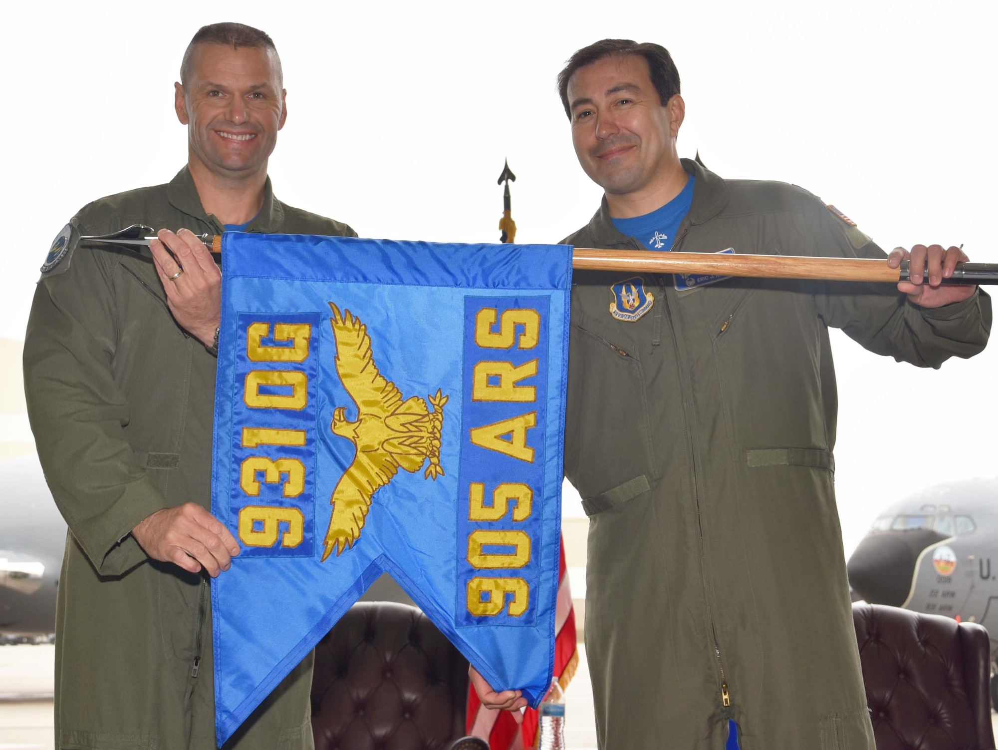 Col. Phil Heseltine, 931st Air Refueling Wing commander, and Lt. Col. Eric Rivero, the incoming 905th Air Refueling Squadron commander, unfurl the 905 ARS guidon during an official ceremony, May 4, 2019, McConnell Air Force Base, Kan. This is one of the first squadrons in the Air Force dedicated to the KC-46A Pegasus.