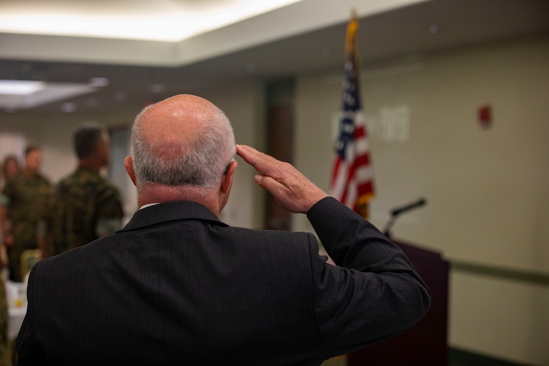 Elder Taylor, military relations with the Church of Jesus Christ of Latter-Day Saints, salutes as the National Anthem plays during the National Day of Prayer’s breakfast, Sam Adams Sports Grill, May 2, 2019. President Harry Truman signed the law in 1952 stating that the National Day of Prayer invites people of all faiths to pray for the nation with President Ronald Reagan adding that the holiday will be observed on the first Thursday of May. (U.S. Marine Corps photo by Cpl. Zachary Orr)