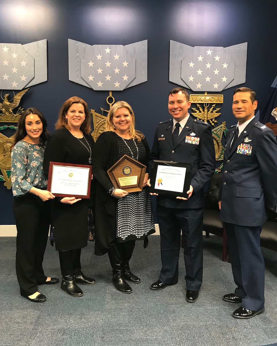 From left to right: Chrystal Crawford, Laurel Tidemason, Julie Morency, U.S. Air National Guard Lt. Col. Joe Wildman, and Col. Keith Ward accept an award for the 146th Airlift Wing's Airman and Family Readiness office headed by Julie Morency, who provided outstanding programs in support to 146 AW airmen and their families during the Department of Defense Reserve Family Readiness Awards presentation at the Pentagon Hall of Heroes, March 29, 2019.