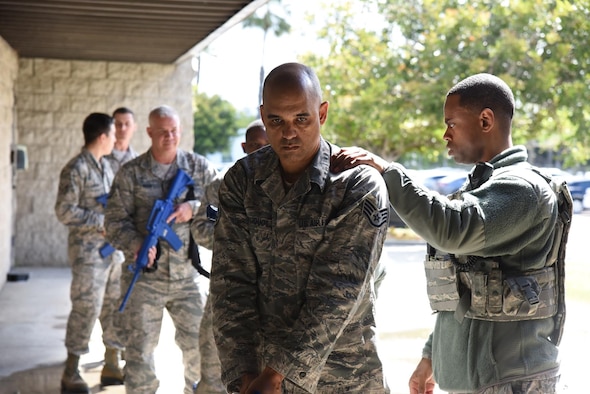 U.S. Air Force Airman 1st Class Damian Cole with the 147th Security Forces Squadron, gives instruction on two-man active shooter training at the 147th Group in San Diego, California, Apr. 6, 2019. Active shooter training is in place so that units are prepared for any threat they may encounter. (U.S. Air Force Photo and caption by Tech. Sgt. Joseph Courtney/ RELEASED)