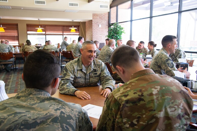 Chief Master Sgt. Kahn Scalise, the 302nd Airlift Wing command chief, provides career progression advice to Airmen during a speed mentoring session May 5, 2019 at the Argon Dining Facility on Peterson Air Force Base, Colorado. (U.S. Air Force photo by Staff Sgt. Heather Heiney)