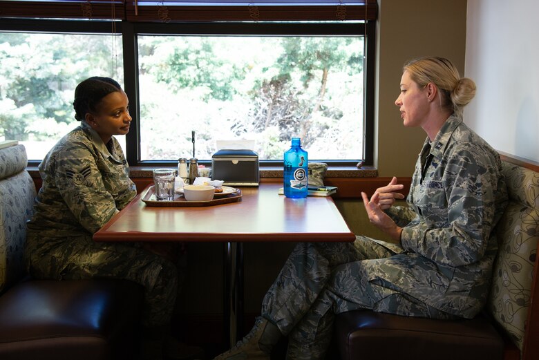 Capt. Jody Partin, with the 302nd Logistics Readiness Squadron, discusses the commissioning process and options with Senior Airman Regat Tsehaye, with the 302nd Airlift Wing, during a speed mentoring session May 5, 2019 at the Argon Dining Facility on Peterson Air Force Base, Colorado. (U.S. Air Force photo by Staff Sgt. Heather Heiney)