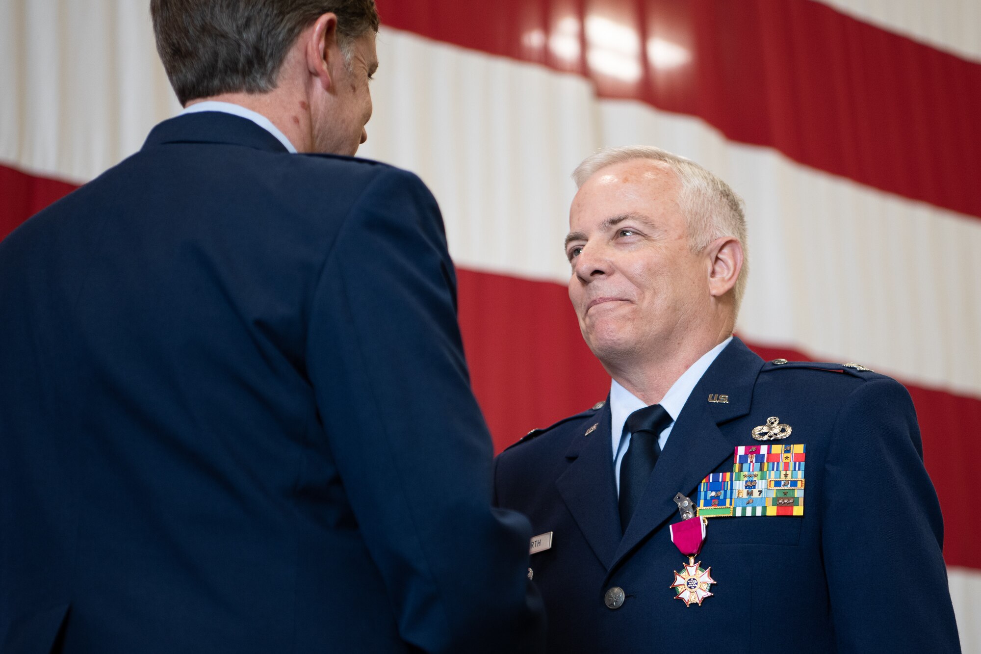 Col. Douglas D. Hayworth, 137th Special Operations Wing vice commander, receives the Legion of Merit from Brig. Gen. Thomas W. Ryan, Assistant Adjutant General - Air, Oklahoma National Guard, for Hayworth's service to the 137th SOW at Will Rogers Air National Guard Base in Oklahoma City, May 4, 2018. Hayworth retired after serving more than 30 years with the Wing. (U.S. Air National Guard Photo by Tech. Sgt. Kasey M. Phipps)