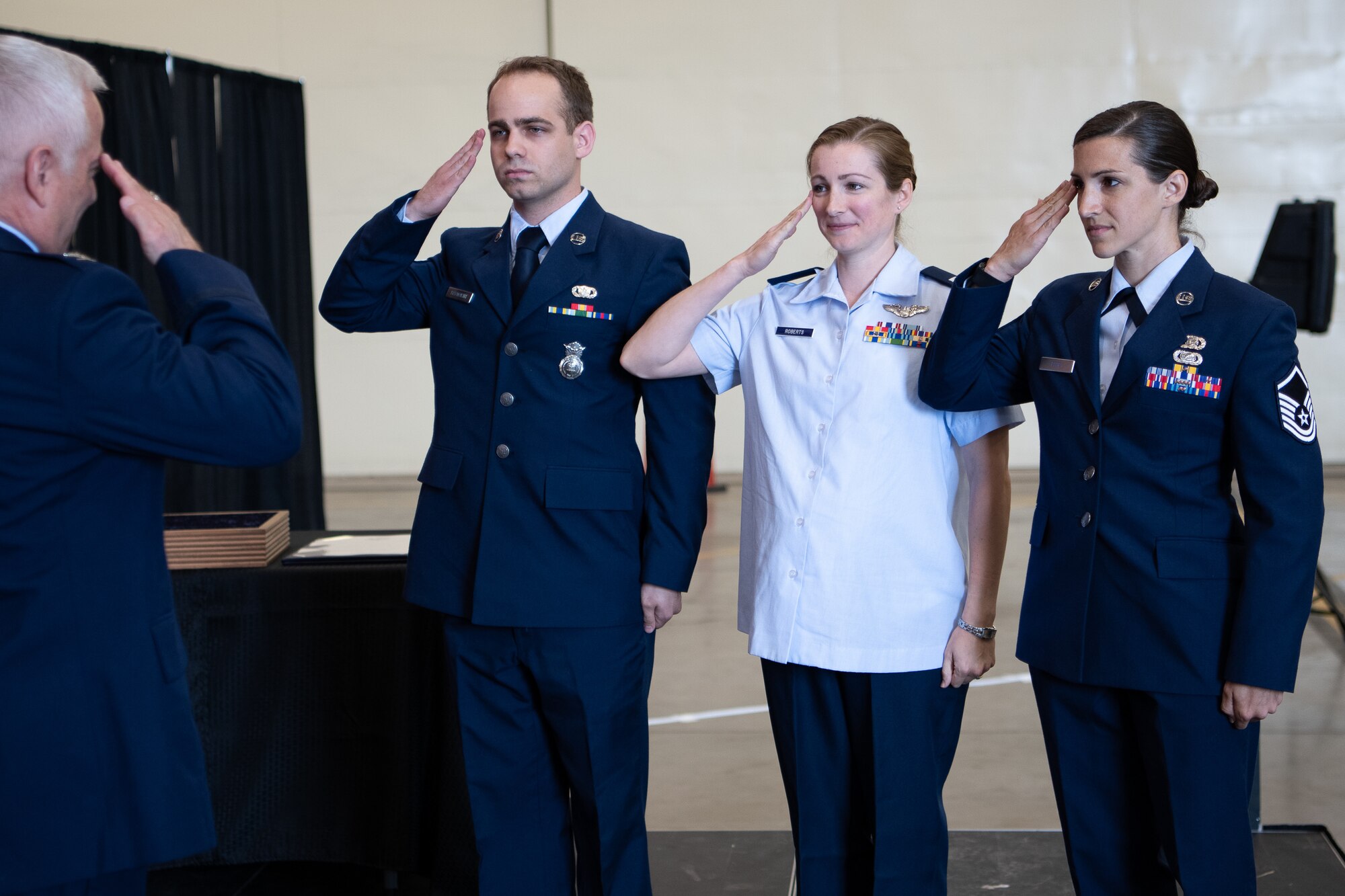Col. Douglas D. Hayworth, 137th Special Operations Wing vice commander, receives final salutes from his three children during his retirement ceremony held in the historical hangar at Will Rogers Air National Guard Base in Oklahoma City, May 4, 2018. Hayworth retired after serving more than 30 years with the Wing. (U.S. Air National Guard Photo by Tech. Sgt. Kasey M. Phipps)