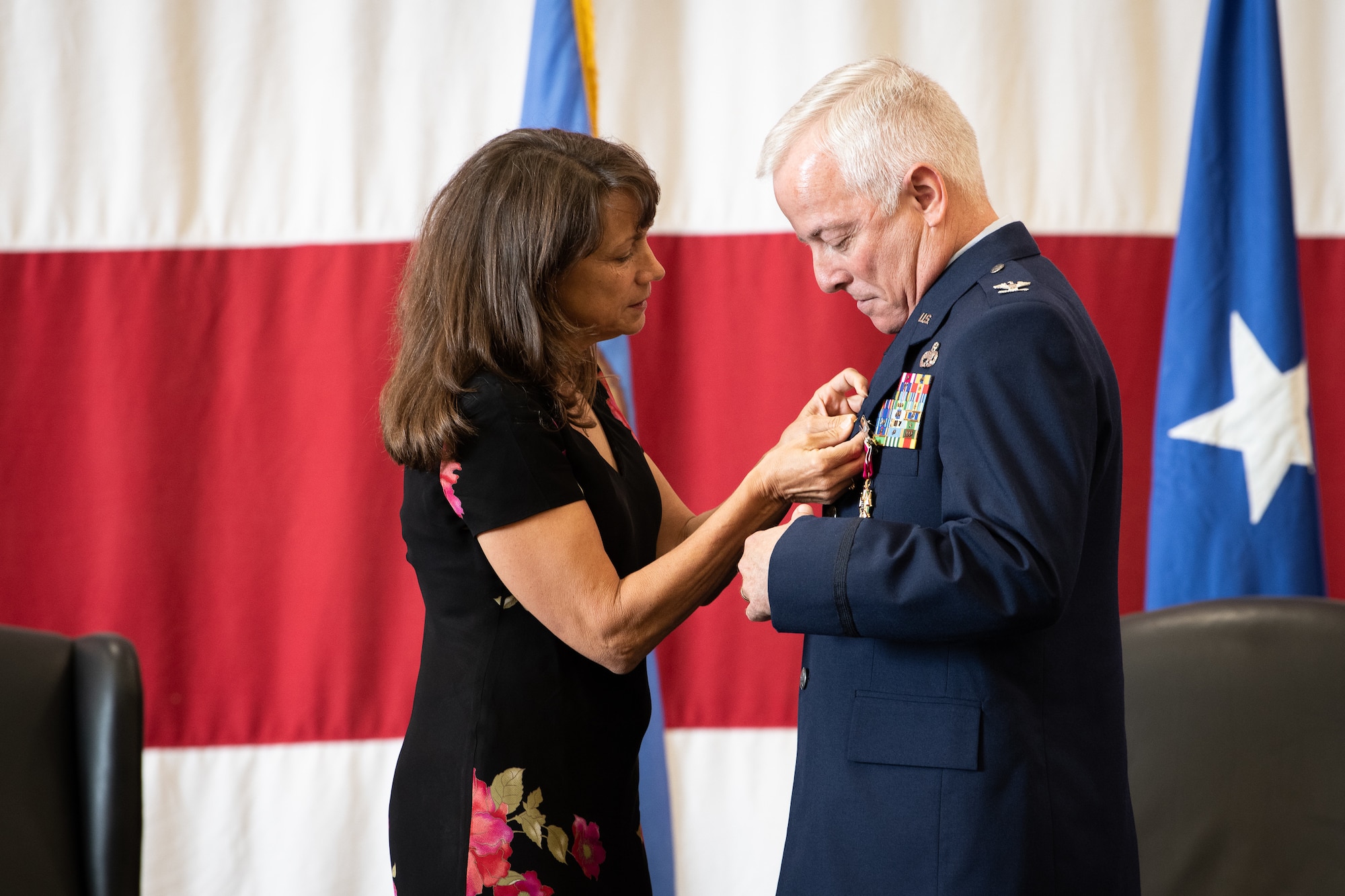 Terri Hayworth pins a retirement pin on Col. Douglas D. Hayworth, 137th Special Operations Wing (137th SOW) vice commander, during his retirement ceremony at Will Rogers Air National Guard Base in Oklahoma City, May 4, 2018. Hayworth retired after serving more than 30 years with the Wing. (U.S. Air National Guard photo by Senior Airman Jordan Martin)