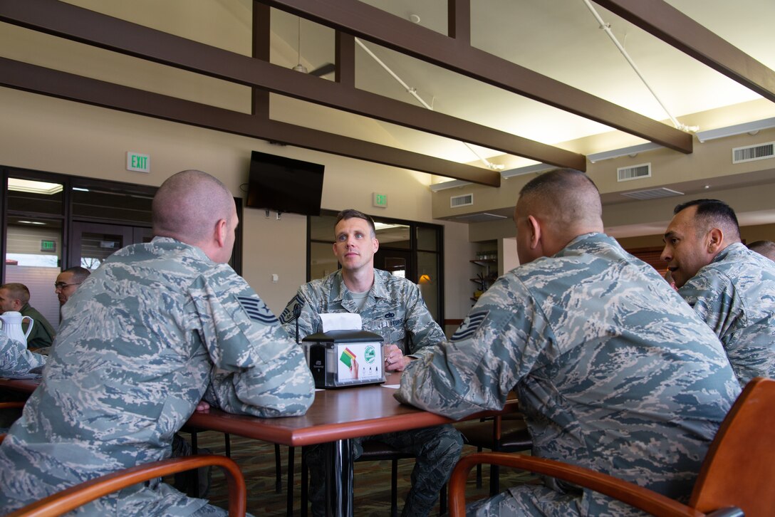 Senior Master Sgt. Benjamin Reich, with the 302nd Maintenance Squadron, mentors noncommissioned officers during a speed mentoring session May 5, 2019 at the Argon Dining Facility on Peterson Air Force Base, Colorado. (U.S. Air Force photo by Staff Sgt. Heather Heiney).