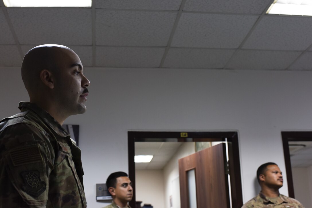 Staff Sgt. Matthew Bertini, 728th Air Mobility Squadron passenger services supervisor and Solutions Group member, briefs the unit March 6, 2019, at Incirlik Air Base, Turkey. The Solutions Group meets monthly to discuss different work-related issues they have either experienced or noticed and brainstorms ways to improve processes and procedures. (U.S. Air Force Air Force photo by Staff Sgt. Matthew J. Wisher)