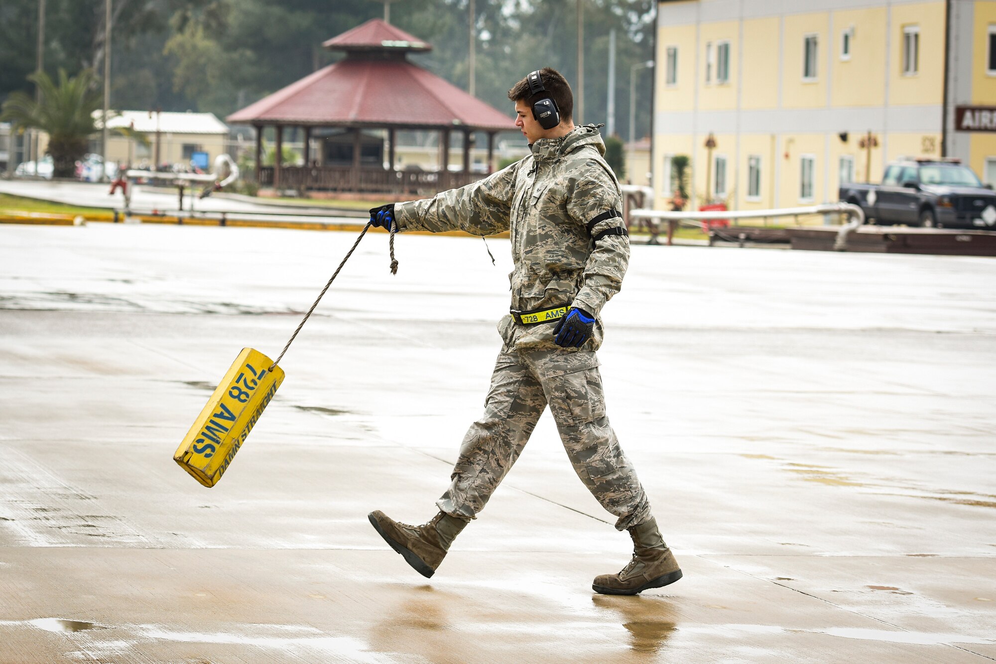 Senior Airman Dane Johnson, 728th Air Mobility Squadron aircraft services journeyman, carries a chock to a K-loader March 3, 2019, at Incirlik Air Base, Turkey. The ramp services section is responsible for offloading all cargo from the aircraft. (U.S. Air Force photo by Staff Sgt. Ceaira Tinsley)