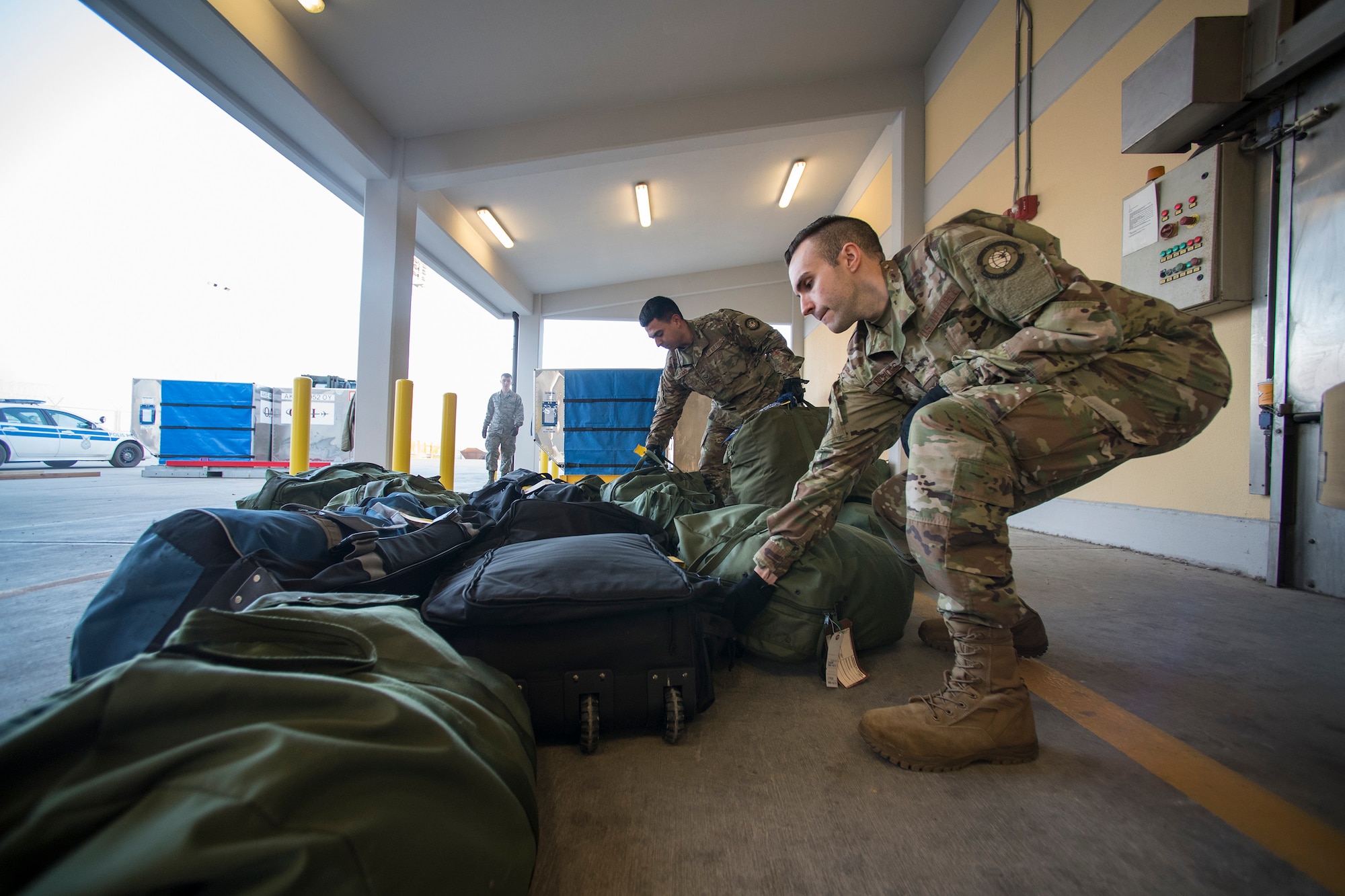 Airmen from the 728th Air Mobility Squadron load luggage March 19, 2019, at Incirlik Air Base, Turkey. The squadron serves as the 39th Air Base Wing’s aerial port and supports transient Department of Defense and allied aircraft. (U.S. Air Force photo by Staff Sgt. Ceaira Tinsley)