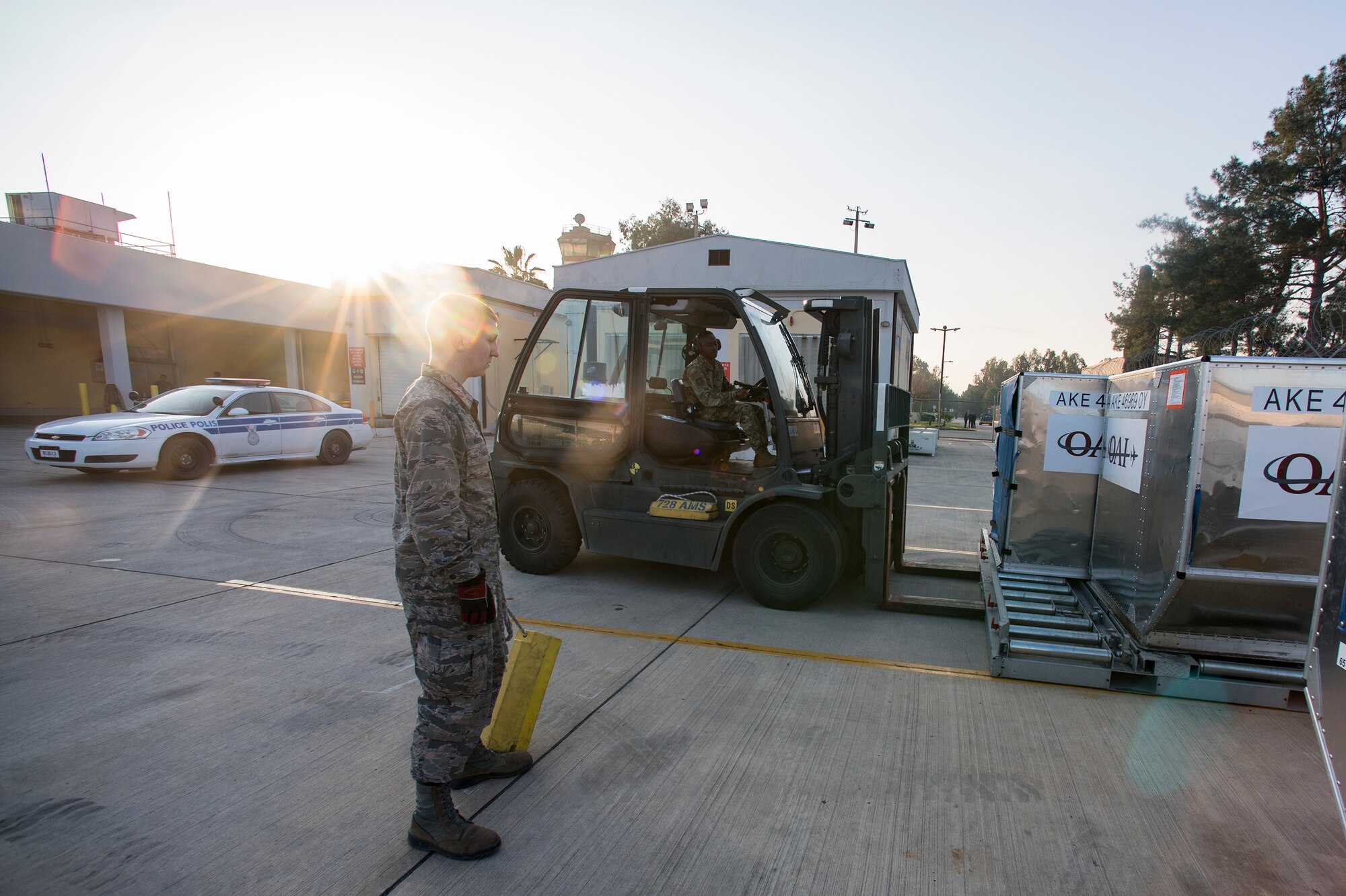 Airmen from the 728th Air Mobility Squadron transport luggage containers March 19, 2019, at Incirlik Air Base, Turkey. The 728th AMS Aircraft Services Flight consists of four sections: ramp services, special handling, clean and dirty fleet and cargo processing. (U.S. Air Force photo by Staff Sgt. Ceaira Tinsley)