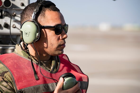 Staff Sgt. Jeff Jordan, 728th Air Mobility Squadron Maintenance Section crew chief, communicates with the pilot prior to aircraft takeoff March 19, 2019, at Incirlik Air Base, Turkey. When the maintenance section gives an all clear, Jordan communicates to the pilot they are cleared to start engines. The Aircraft Maintenance Flight projects Air Mobility Command’s global air mobility mission by executing flight line operations to generate, launch, recover, service and repair C-17 Globemaster III, C-5 Galaxy, and other commercial cargo aircraft. (U.S. Air Force photo by Staff Sgt. Ceaira Tinsley)