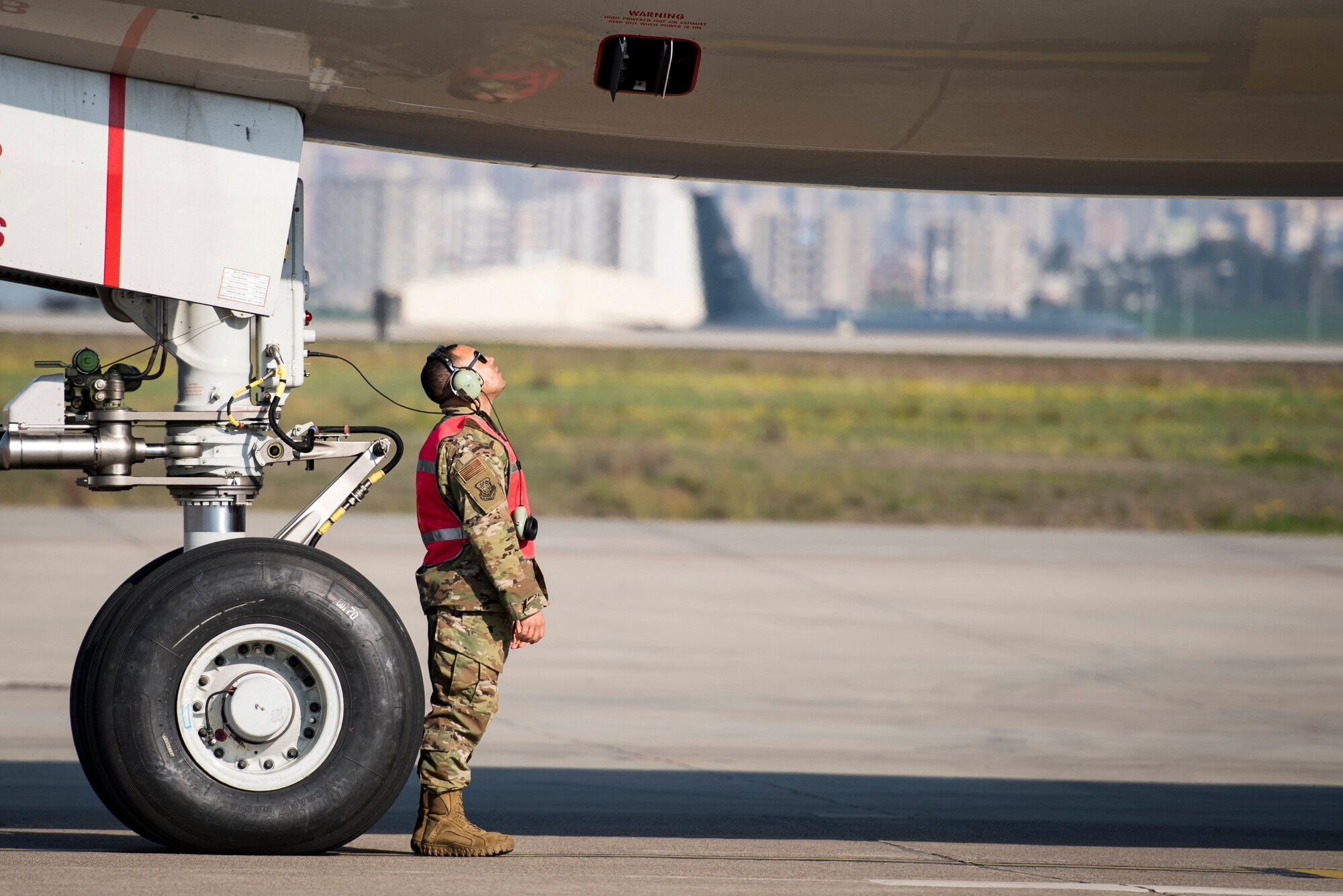 Staff Sgt. Jeff Jordan, 728th Air Mobility Squadron Maintenance Section crew chief checks the bottom of an aircraft prior to takeoff March 19, 2019, at Incirlik Air Base, Turkey. Unique to the 728th AMS, maintenance airmen are assigned to the unit to maintain transit aircraft when needed. (U.S. Air Force photo by Staff Sgt. Ceaira Tinsley)