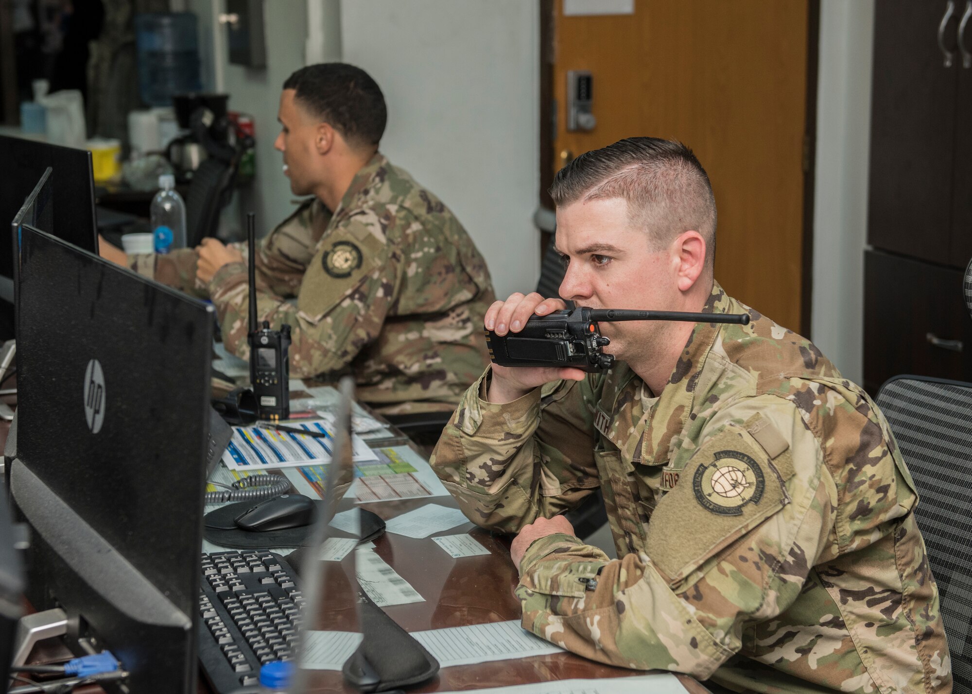 Senior Airman Paul Withrow, 728th Air Mobility Squadron information controller, radios for a flight update April 16, 2019, at Incirlik Air Base, Turkey. The air terminal operations center is responsible for all coordination between the terminal, Airmen in the freight and the aircraft itself to keep all sections updated and synchronized. (U.S. Air Force photo by Staff Sgt. Kirby Turbak)