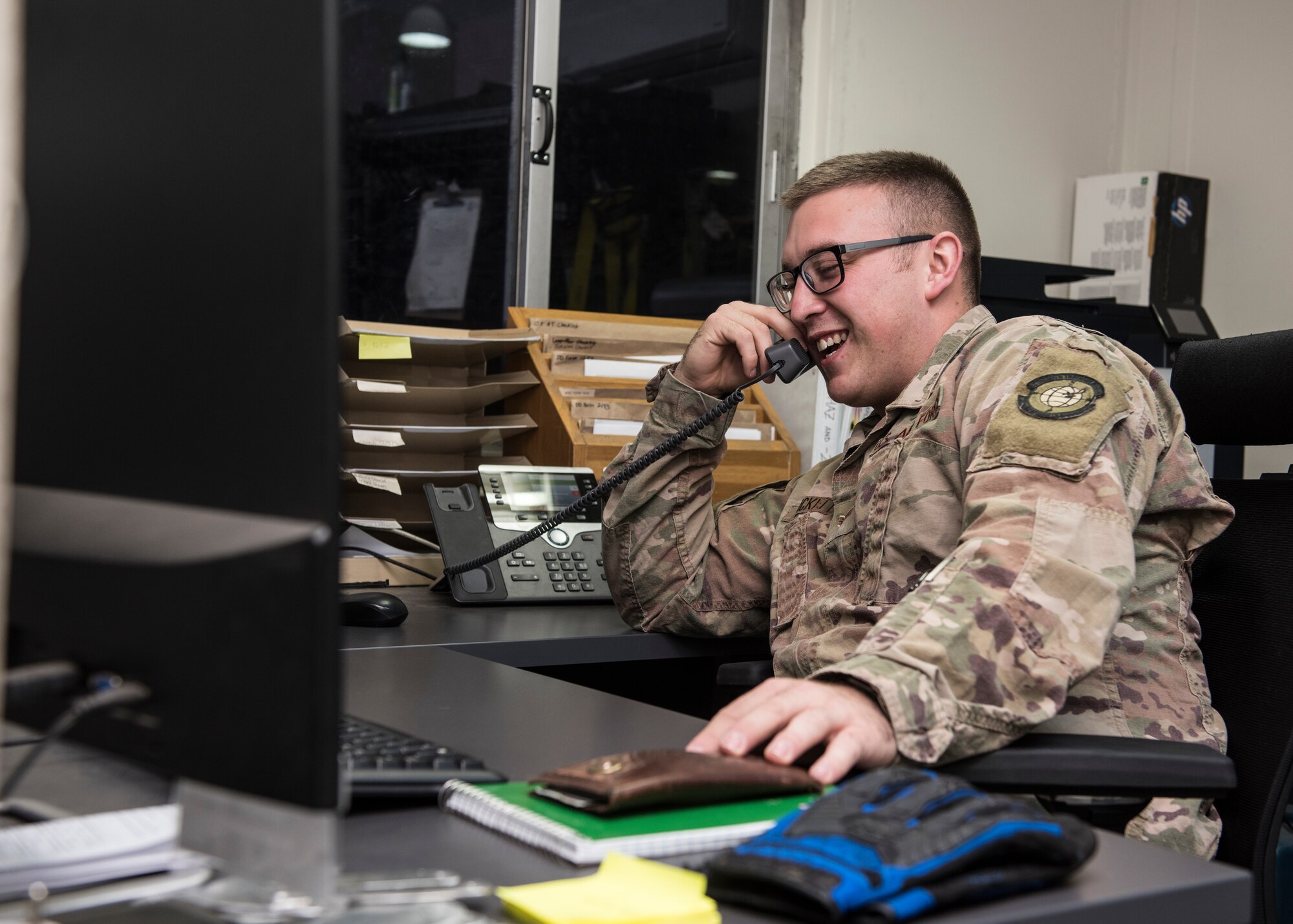 Senior Airman Trevor Bickett, 728th Air Mobility Squadron aircraft services journeyman discusses an operational requirement April 16, 2019, at Incirlik Air Base, Turkey. The 728th AMS maintains all transient and assigned aircraft while serving as the gateway to U.S. Air Forces Central Command. (U.S. Air Force photo by Staff Sgt. Kirby Turbak)