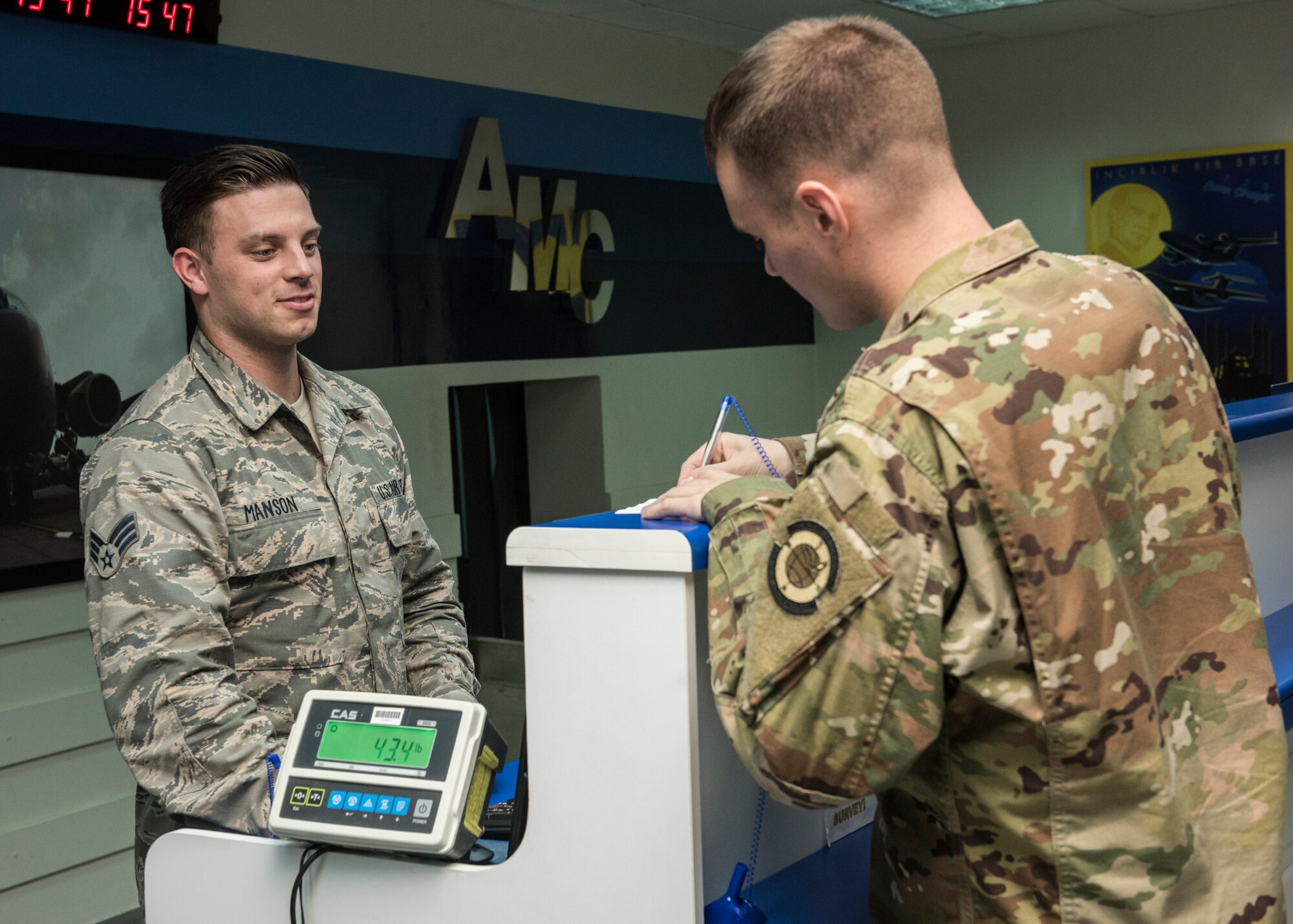 Senior Airman Cameron Manson, 728 Air Mobility Squadron passenger service representative, checks in an Airmen April 16, 2019, at Incirlik Air Base, Turkey. Manson is responsible for ensuring all passengers and luggage are loaded safely and efficiently on to the aircraft. (U.S. Air Force photo by Staff Sgt. Kirby Turbak)