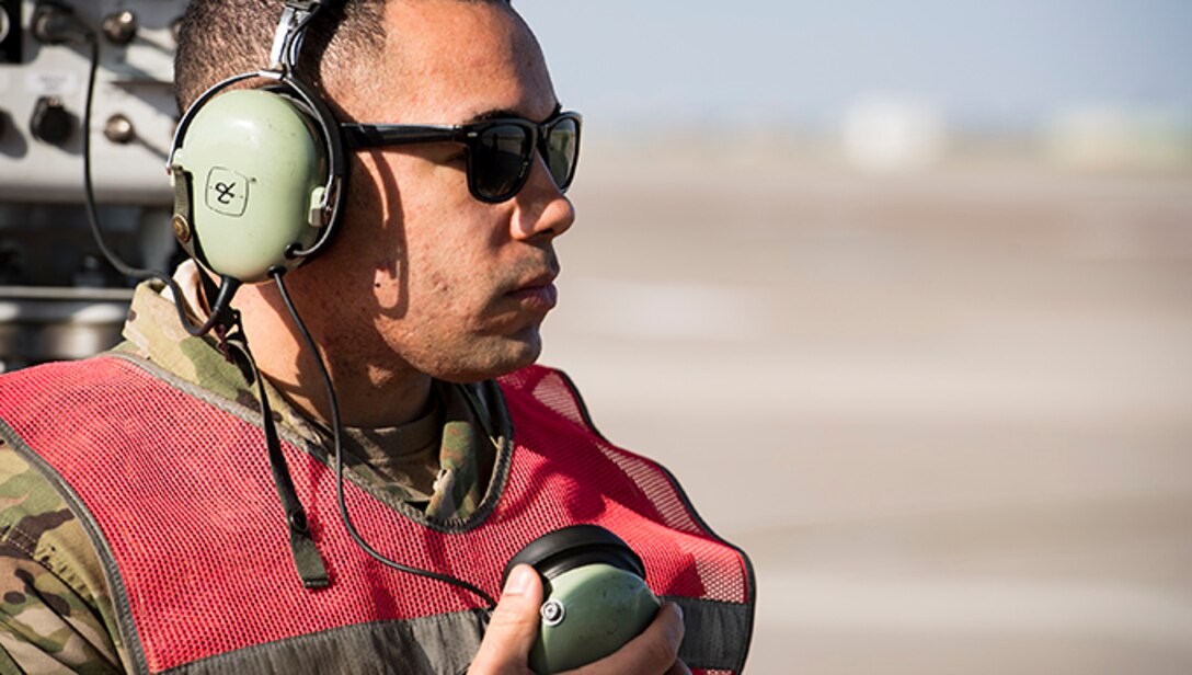 Staff Sgt. Jeff Jordan, 728th Air Mobility Squadron Maintenance Section crew chief, communicates with the pilot prior to aircraft takeoff March 19, 2019, at Incirlik Air Base, Turkey. When the maintenance section gives an all clear, Jordan communicates to the pilot they are cleared to start engines. The Aircraft Maintenance Flight projects Air Mobility Command’s global air mobility mission by executing flight line operations to generate, launch, recover, service and repair C-17 Globemaster III, C-5 Galaxy, and other commercial cargo aircraft. (U.S. Air Force photo by Staff Sgt. Ceaira Tinsley)