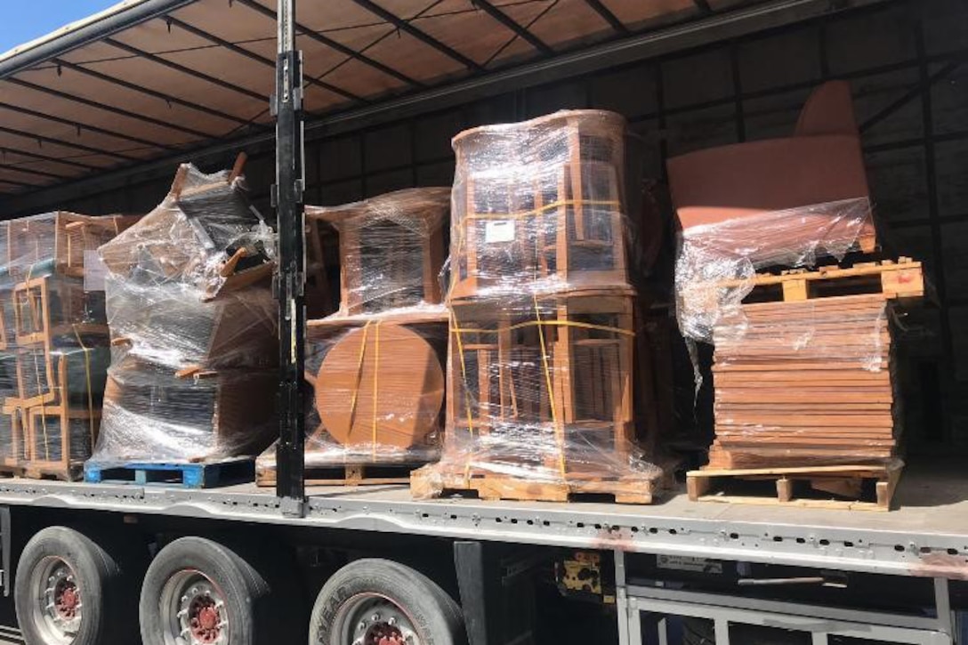 More chairs and some tables await transport from the DLA Disposition Services site in Bahrain to the local Red Crescent Society where they will help those in need.