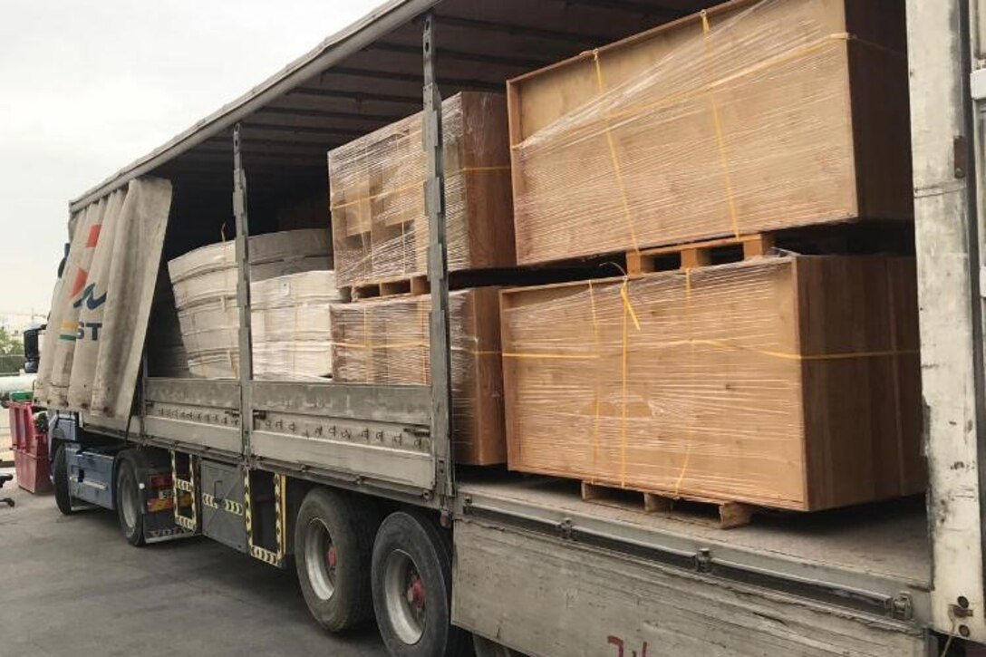 Mattresses and bed frames await transport from the DLA Disposition Services site in Bahrain to the local Red Crescent Society where they will help those in need.