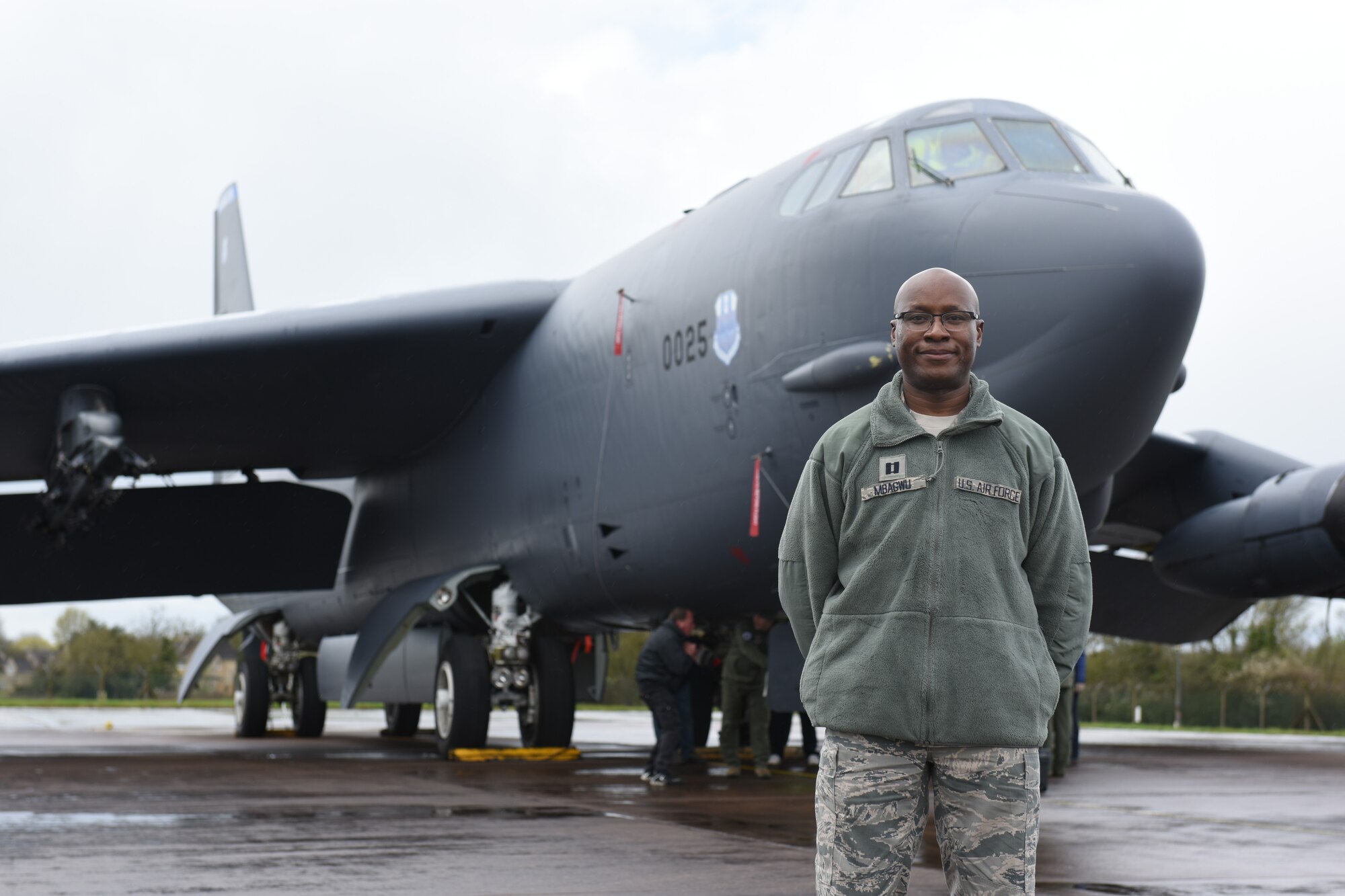 U.S. Air Force Capt. Brenden Mbagwu, 501st Combat Support Wing chaplain, poses in front of a B-52 Stratofortress at RAF Fairford, April 2, 2019. Mbagwu participated in the Young Adult Summit to develop better skillsets by learning to work with young Airmen. (U.S. Air Force photo by Airman 1st Class Jennifer Zima)