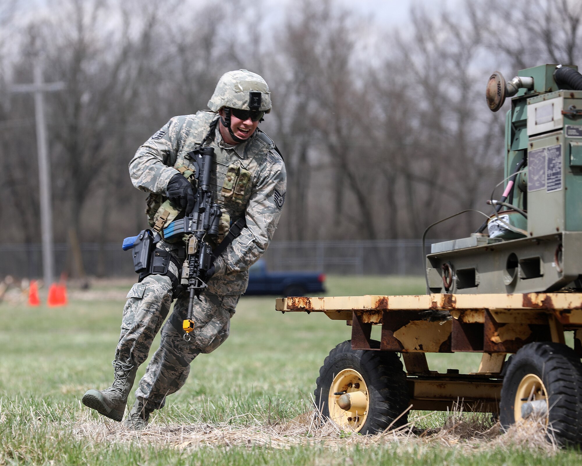 Staff Sgt. Cody Bone, 445th Security Forces Squadron, takes cover during the 445th Airlift Wing's annual Agile Combat Support exercise April 6, 2019. More than 80 Airmen from the 445th Airlift Wing participated in the exercise April 5-7.
