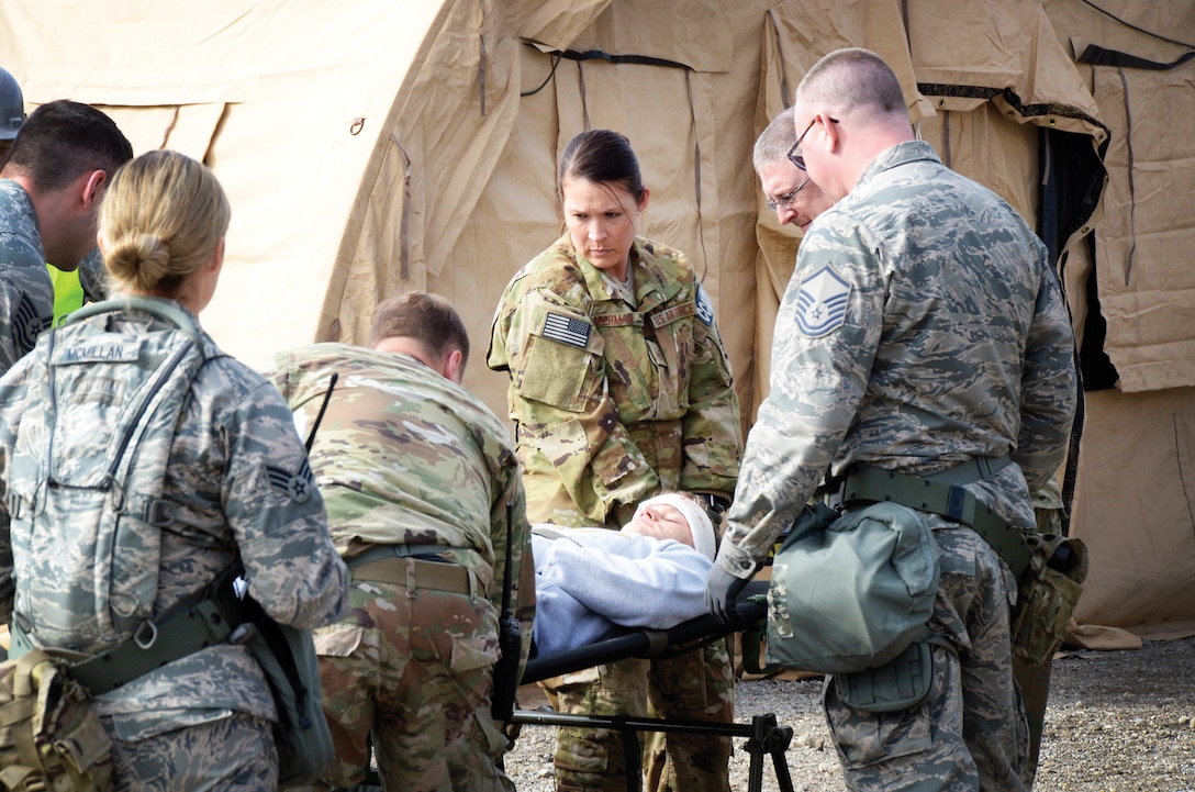 Reserve Citizen Airmen of the 445th Aeromedical Staging Squadron, prepare for patient transport during training at the Warfighter Training Center here April 6, 2019. The simulation tested the squadron’s ability to load and unload patients from aircraft while making sure they receive the best medical care for their travels.