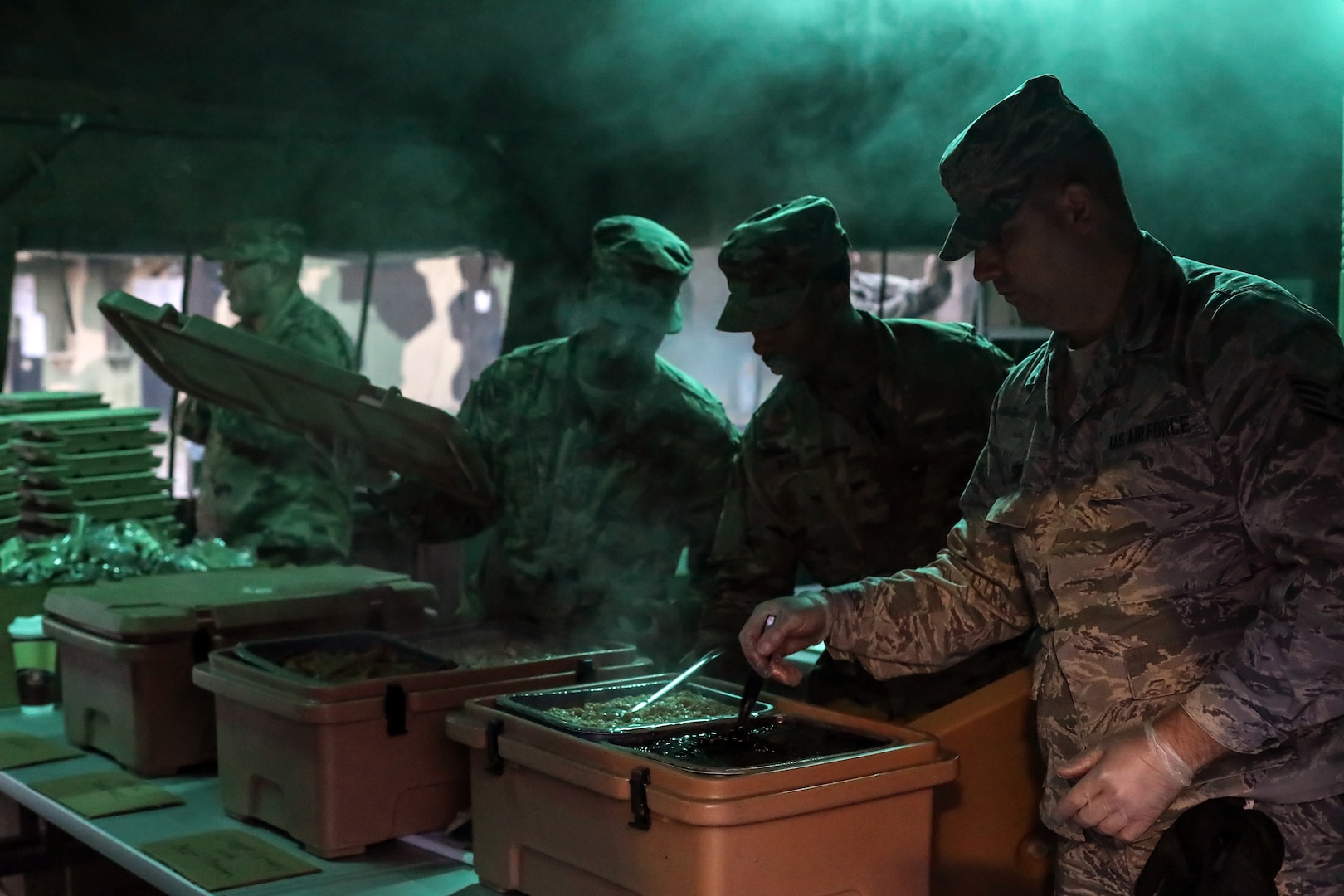 Members of the 445th Force Support Squadron serve breakfast during the 445th Airlift Wing’s annual Agile Combat Support exercise at the Warfighter Training Center April 7, 2019.