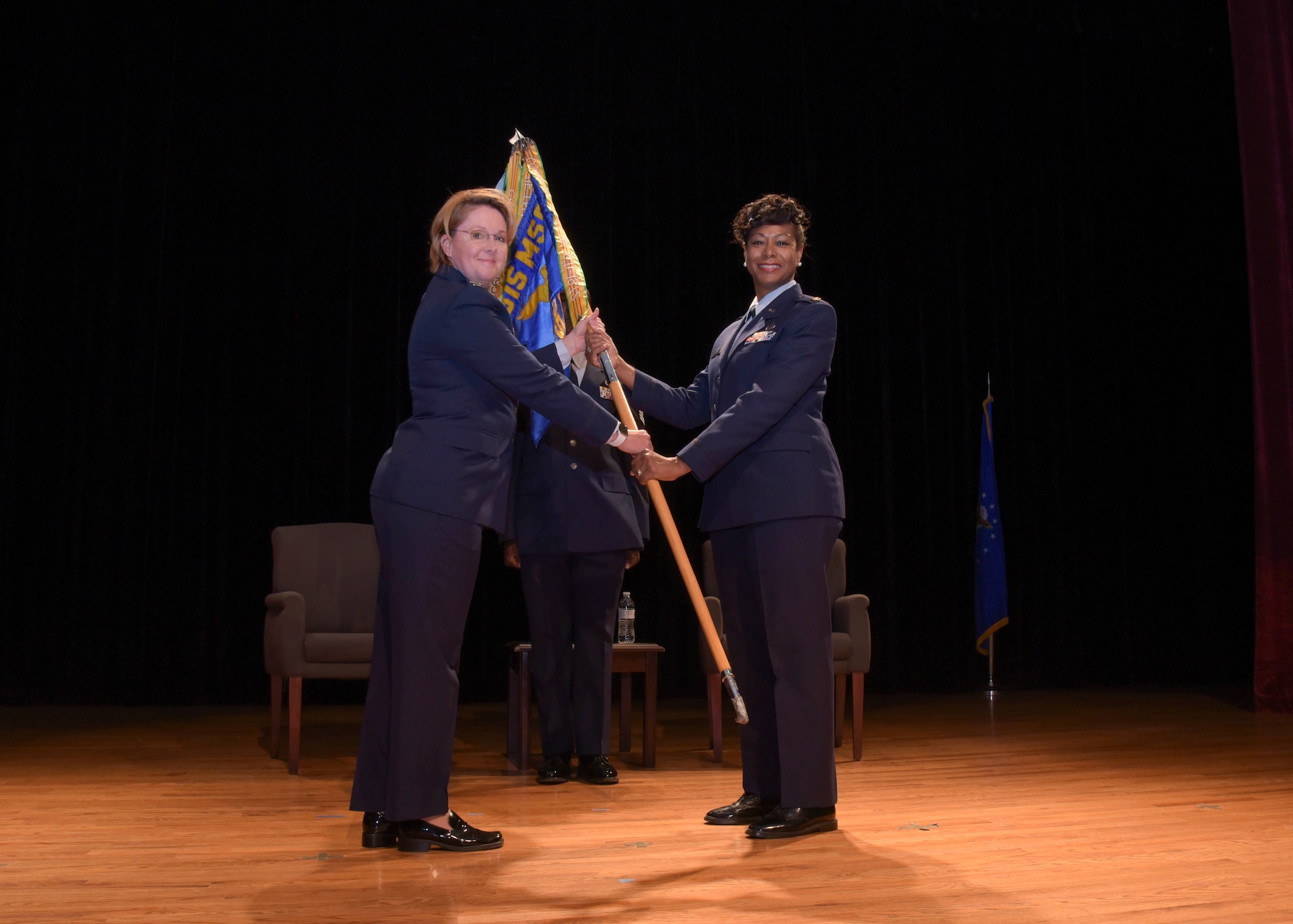Maj. Kimberly Champagne (right) receives the 315th Force Support Squadron guidon from Col. Cherie Roff, 315th Force Support Squadron commander, during a change-of-command ceremony Sunday, May 5, 2019, at Joint Base Charleston, S.C