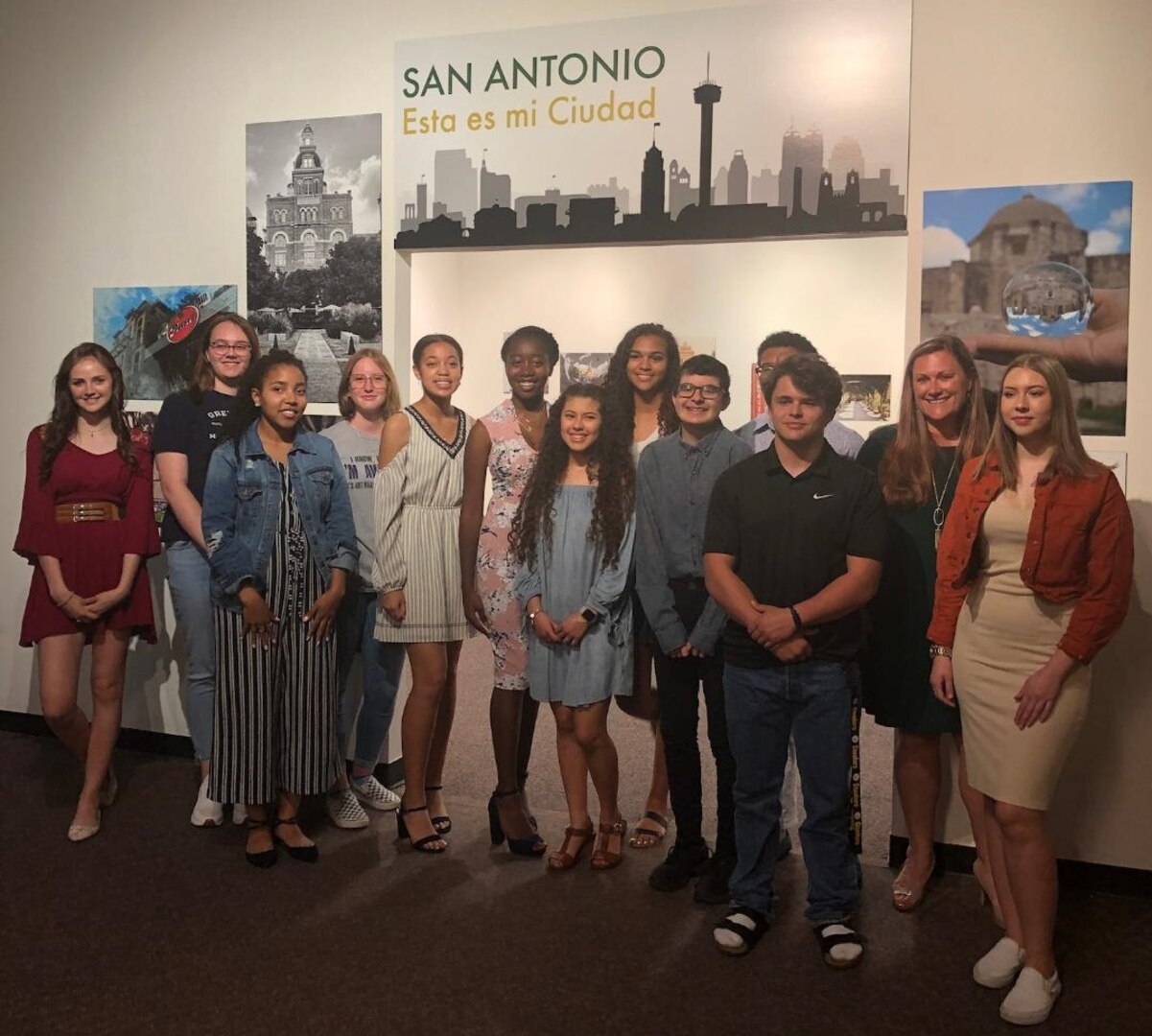 Students from the Cole High School photography program and their teacher, Brenda Marafioto (second from right) attend the opening reception of the “San Antonio: Esta es mi Ciudad” exhibit at the Institute of Texan Cultures March 29. The exhibit displays 31 images taken from among 16 students in the Cole photography program.