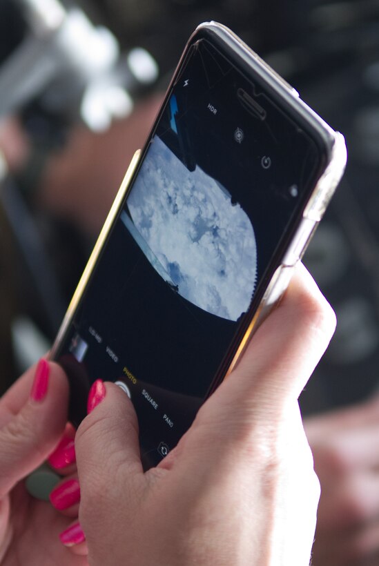 A civic leader from Dyess Air Force Base, Texas takes a photograph from the boom operator station on a KC-135 Stratotanker, May 1, 2019.  Dozens of civic leaders traveled to Wright-Patterson AFB, Ohio to learn more about the Air Force Reserve mission.  During the two-day event, they were able to visit multiple sites on the base, including the 445th Airlift Wing. (U.S. Air Force photo by Master Sgt. Ted Daigle)