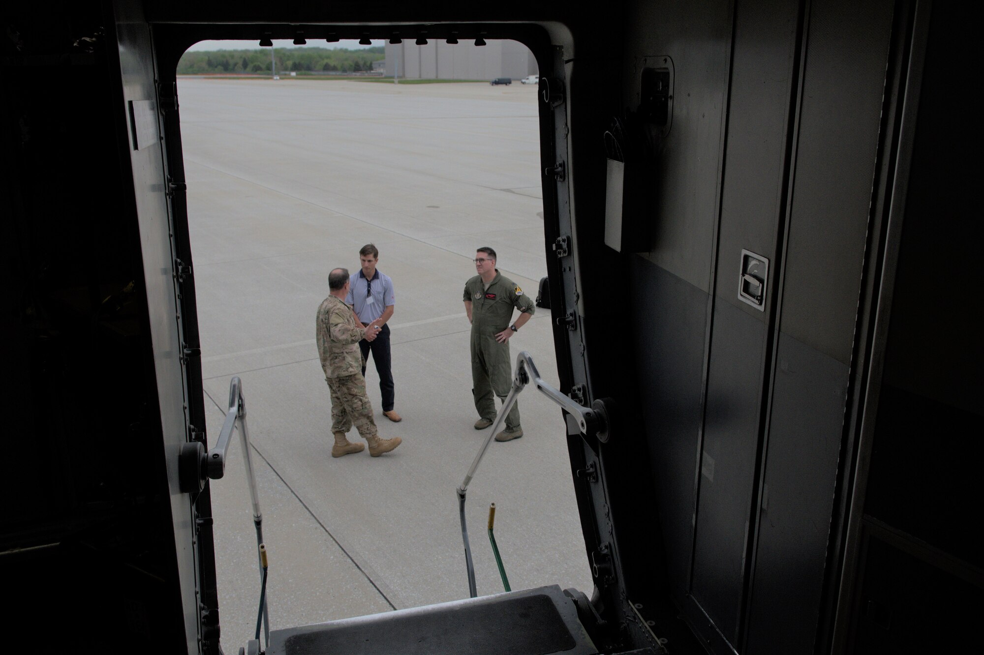U.S. Air Force Col. Adam Willis, 445th Airlift Wing commander, and Col. Brian McClanahan, 489th Bomb Group commander, speak with Tyler Sitzes at Wright-Patterson Air Force Base, Ohio, May 2, 2019. Sitzes was one of several local civilian influencers from Abiline, Texas taking part in a civic leader tour to learn more about the 445th AW and its mission. (U.S. Air Force photo by Master Sgt. Ted Daigle)