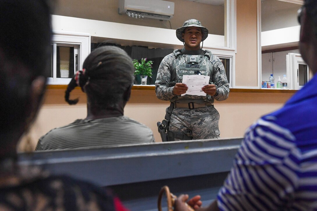 U.S. Air Force Staff Sgt. Charles Owens briefs Guyanese patients about ophthalmology surgery postoperative care during New Horizons exercise 2019 at Port Mourant, Guyana, May 4, 2019.