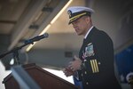 The official party from the Arleigh Burke-class guided-missile destroyer USS Donald Cook (DDG 75) salute as the color guard parades the colors during a change of command ceremony for the ship, May 3, 2019.