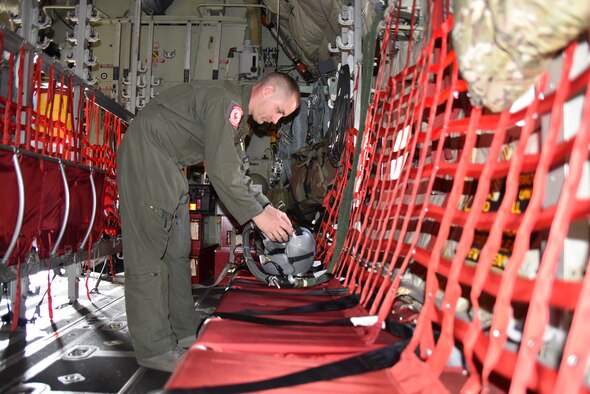 Senior Airman John Boudreaux loadmaster, 815th Airlift Squadron checks his helmet aboard a C-130J Super Hercules, April 18, 2019, Keesler Air Force Base, Mississippi. Boudreaux suffered three fractured vertebra in a car wreck. After receiving surgery and completing physical therapy, he attended loadmaster school for a second time and is in the process of completing his training to become a fully qualified loadmaster.  (U.S. Air Force photo by Tech Sgt. Michael Farrar)