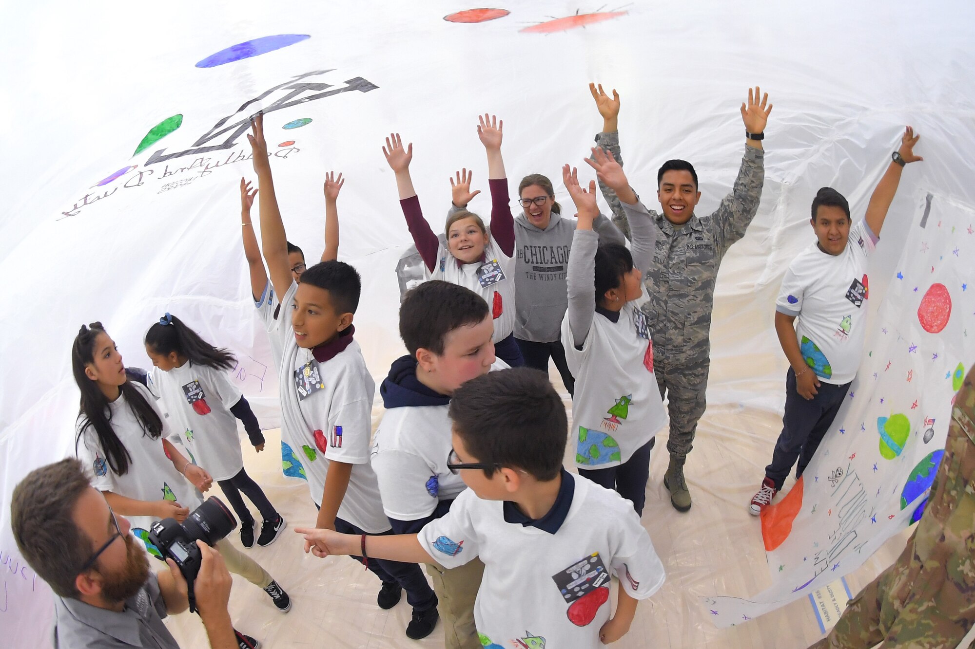 Airman 1st Class Kenny Dela Cruz, 75th Comptroller Squadron, and fifth grade school children during the building of a simulated space habitat called ‘Mission to Mars’ at Weber State University May 2, 2019. Mission to Mars is facilitated by Hill Air Force Base as part of the STEM Outreach Program, which partners with local school teachers by providing a curriculum, materials and events to teach STEM-related subjects in a creative and fun environment. (U.S. Air Force photo by Todd Cromar)