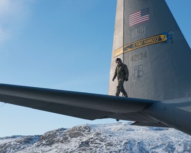 Tech. Sgt. Trenton Zanow, 118th Airlift Squadron flight engineer, inspects the wing of a C-130H aircraft, April 2, 2019, in Kangerlussuaq, Greenland. The 118th flew to Greenland in support of the National Science Foundation climate research mission.