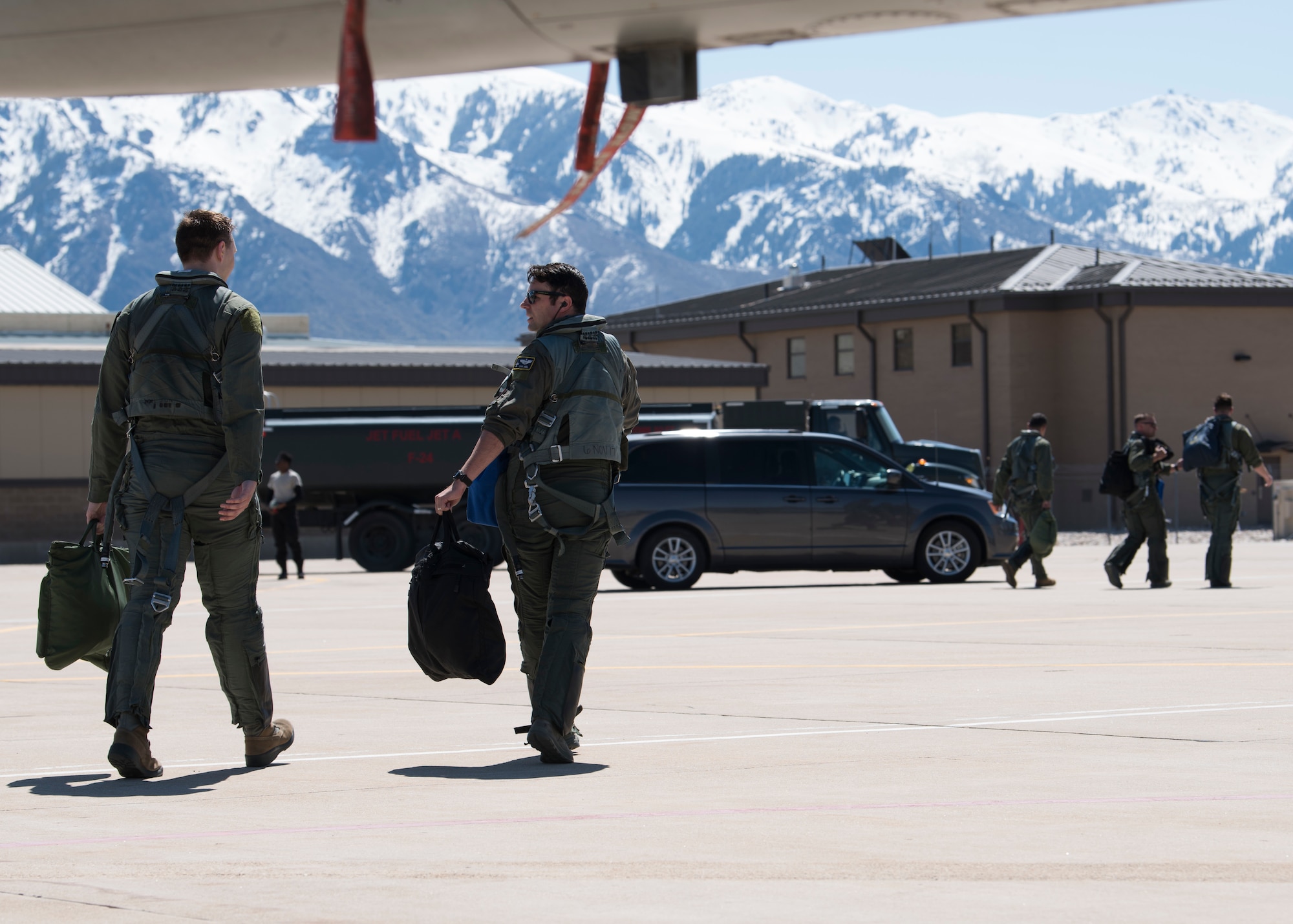 Maj. David Abel, 311th Fighter Squadron instructor pilot, and an incentive flight passenger walk across the flightline, May 2, 2019, on Hill Air Force Base, Utah. Abel flew the final sortie of his instructor pilot upgrade training, April 23, 2019, during the first day of exercise Venom 19-01, and flew his passenger in his first familiarization flight the last day of the exercise. (U.S. Air Force photo by Staff Sgt. BreeAnn Sachs)